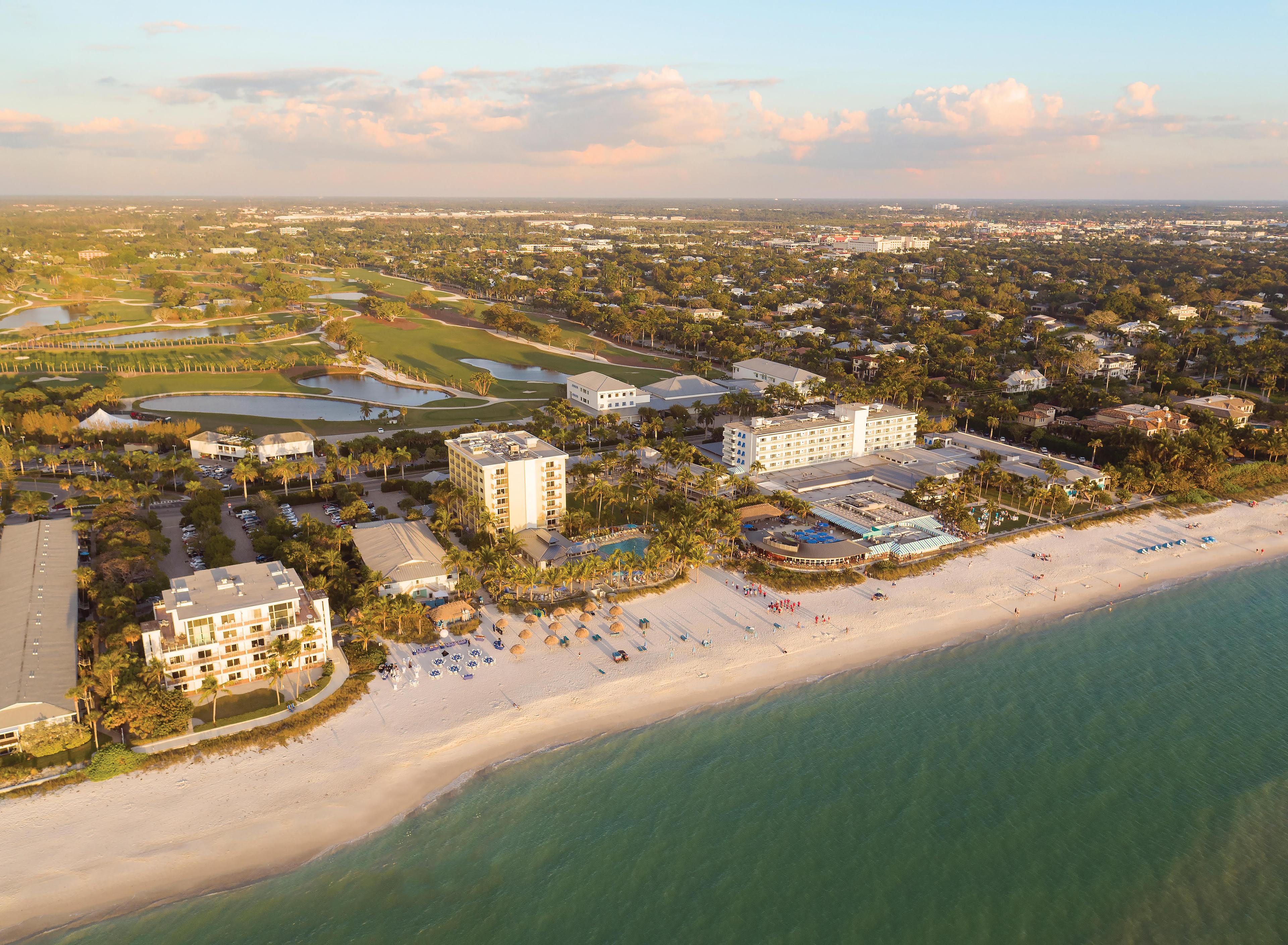 Aerial view looking down on the coastal Naples Beach Hotel and Golf Club