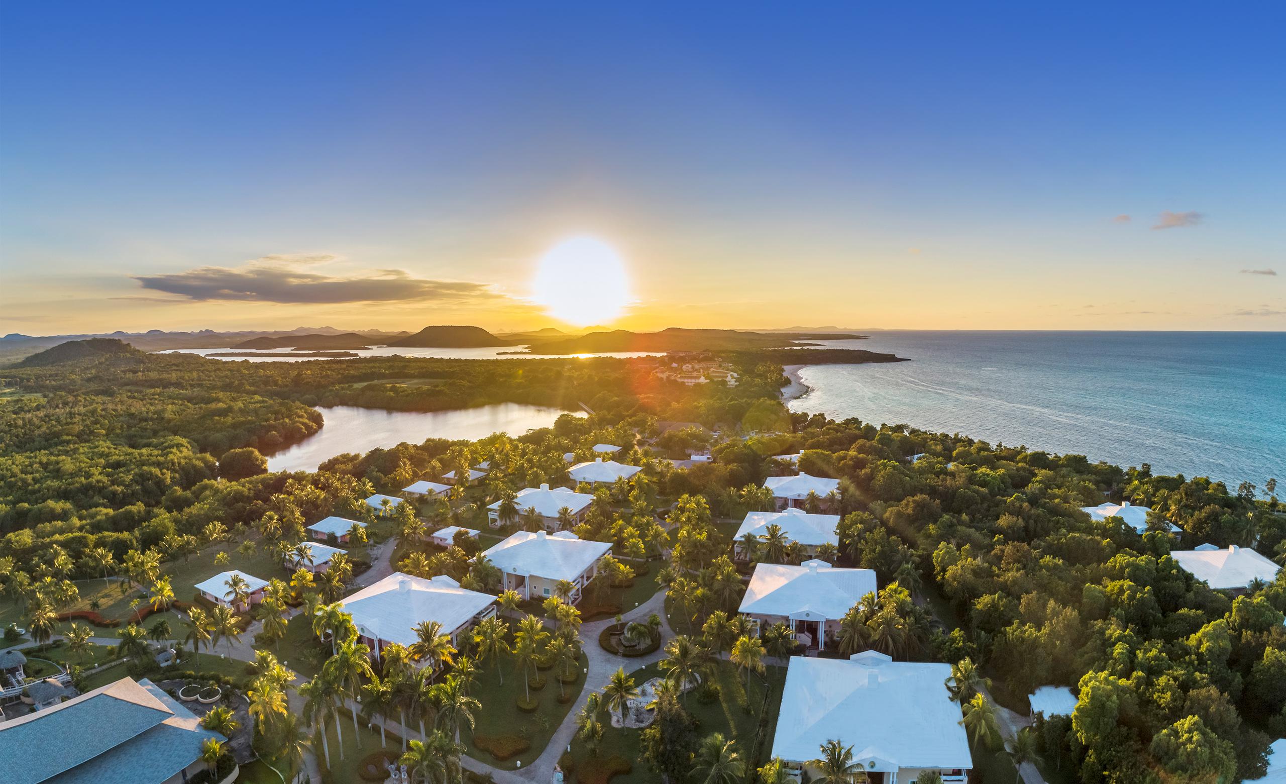 Overhead view of the sun setting over Paradisus Rio de Oro Resort & Spa