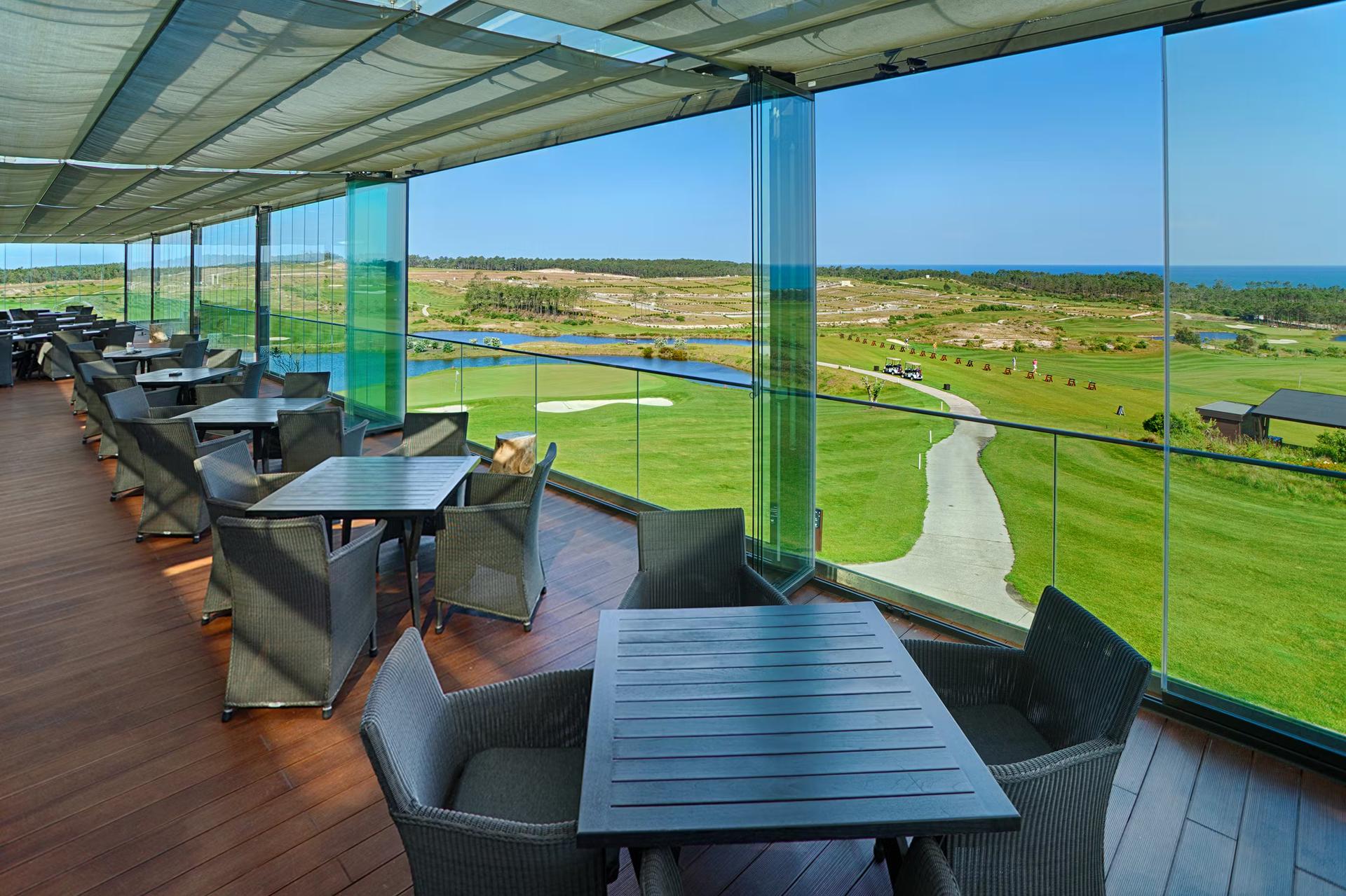 Indoor dining room at Royal Obidos Evolutee Hotel Spa & Golf Resort with views of the course