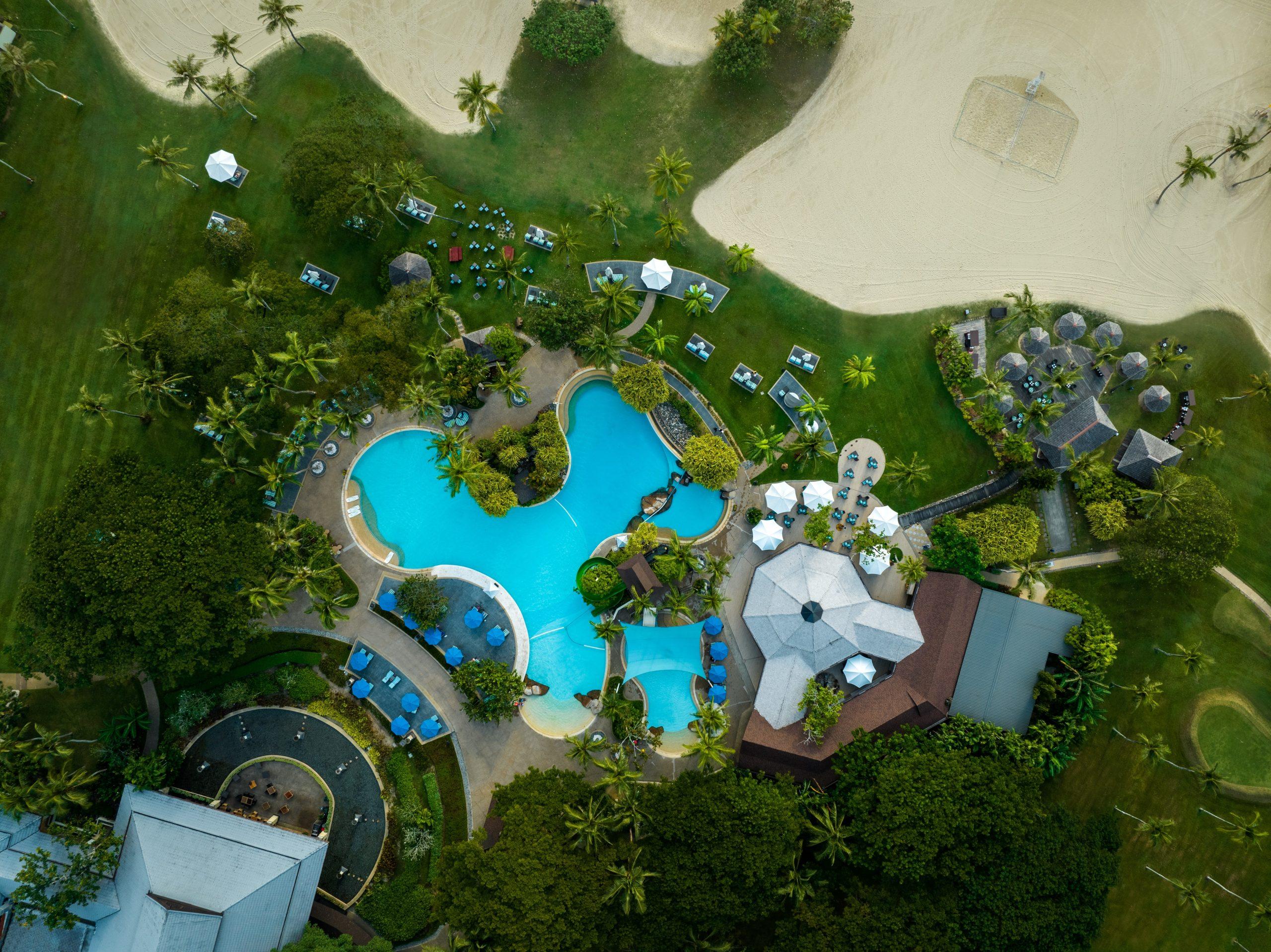 Aerial view of the outdoor swimming pool at Shangri-La’s Rasa Ria Resort & Spa