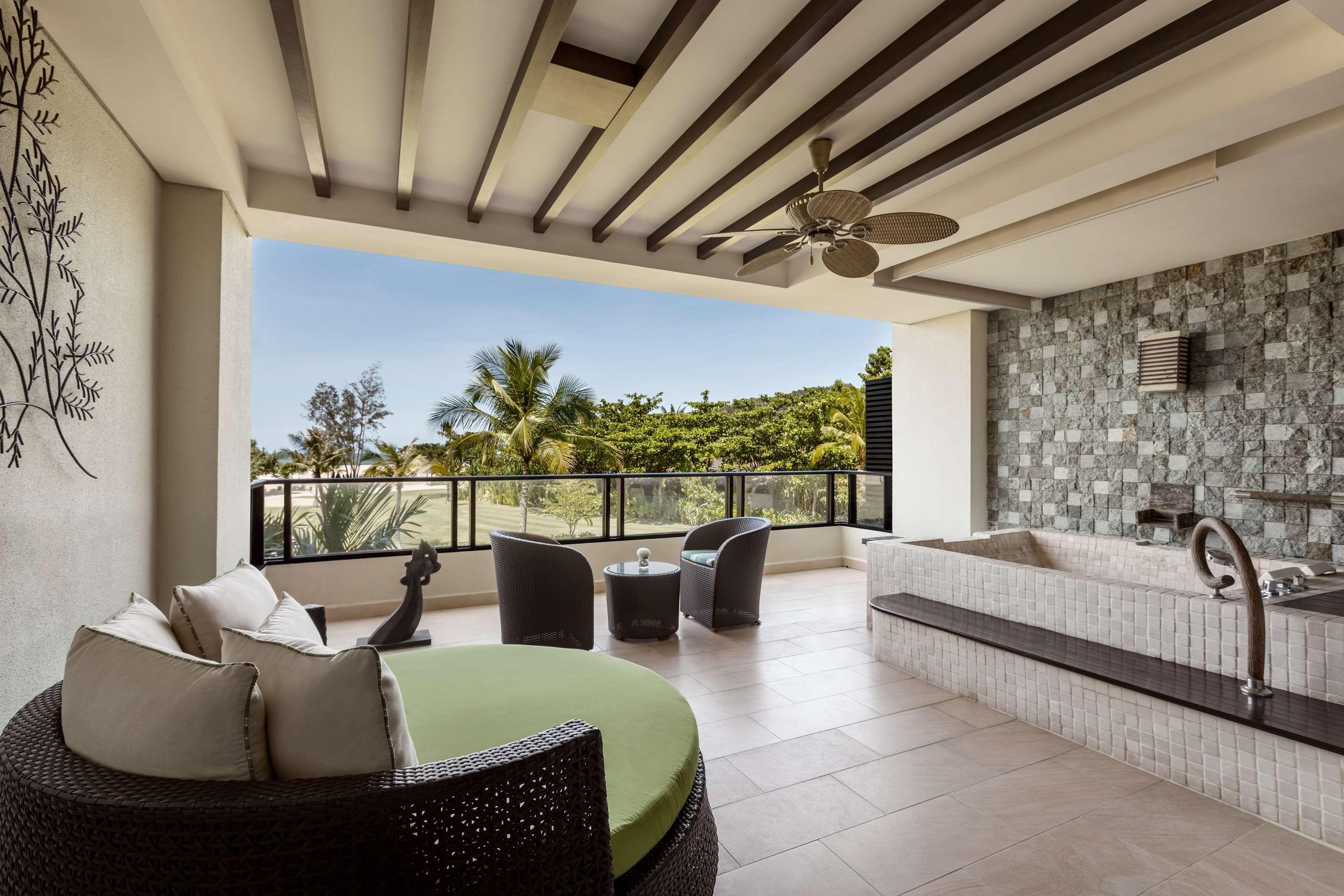 Spacious balcony with a jacuzzi at Shangri-La’s Rasa Ria Resort & Spa