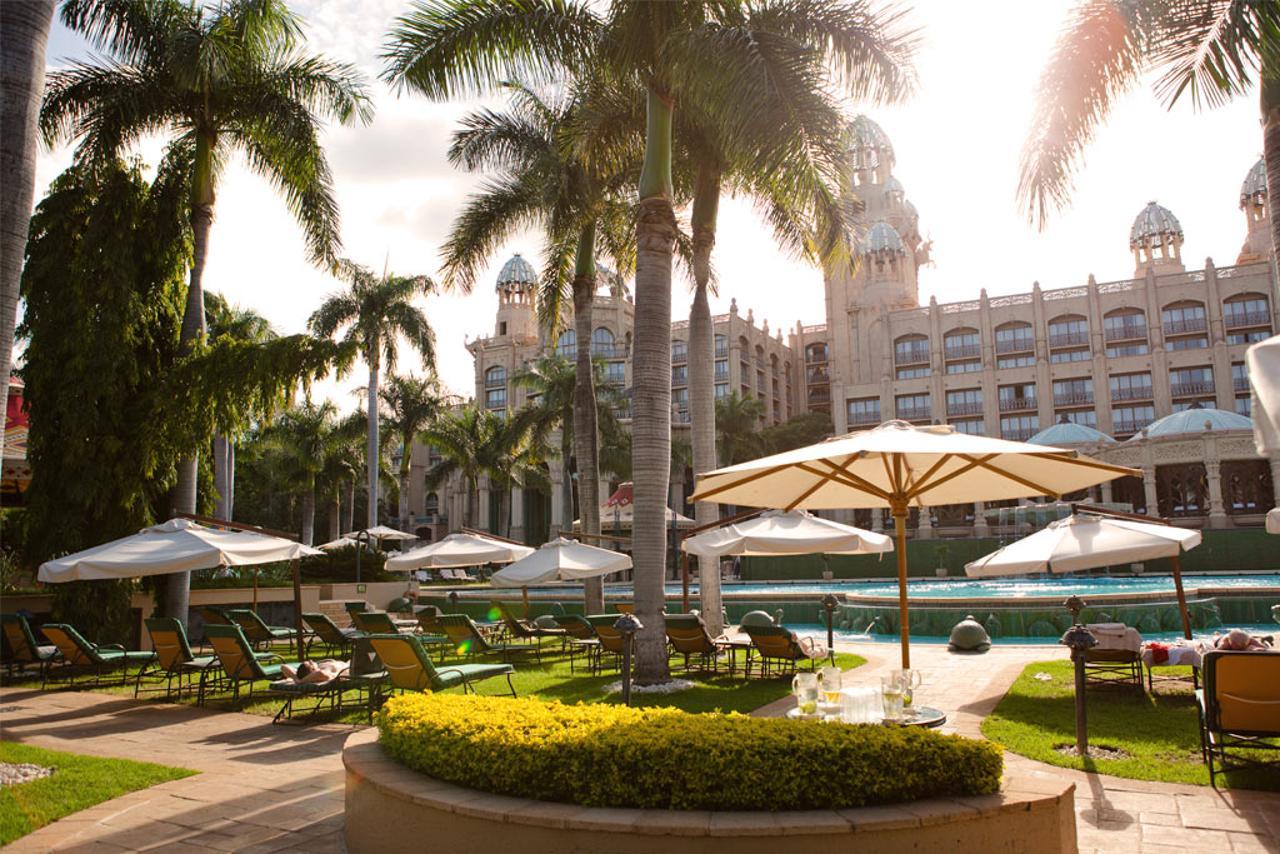 Poolside lounging area with sunbeds at the Sun City Resort, The Palace of the Lost City