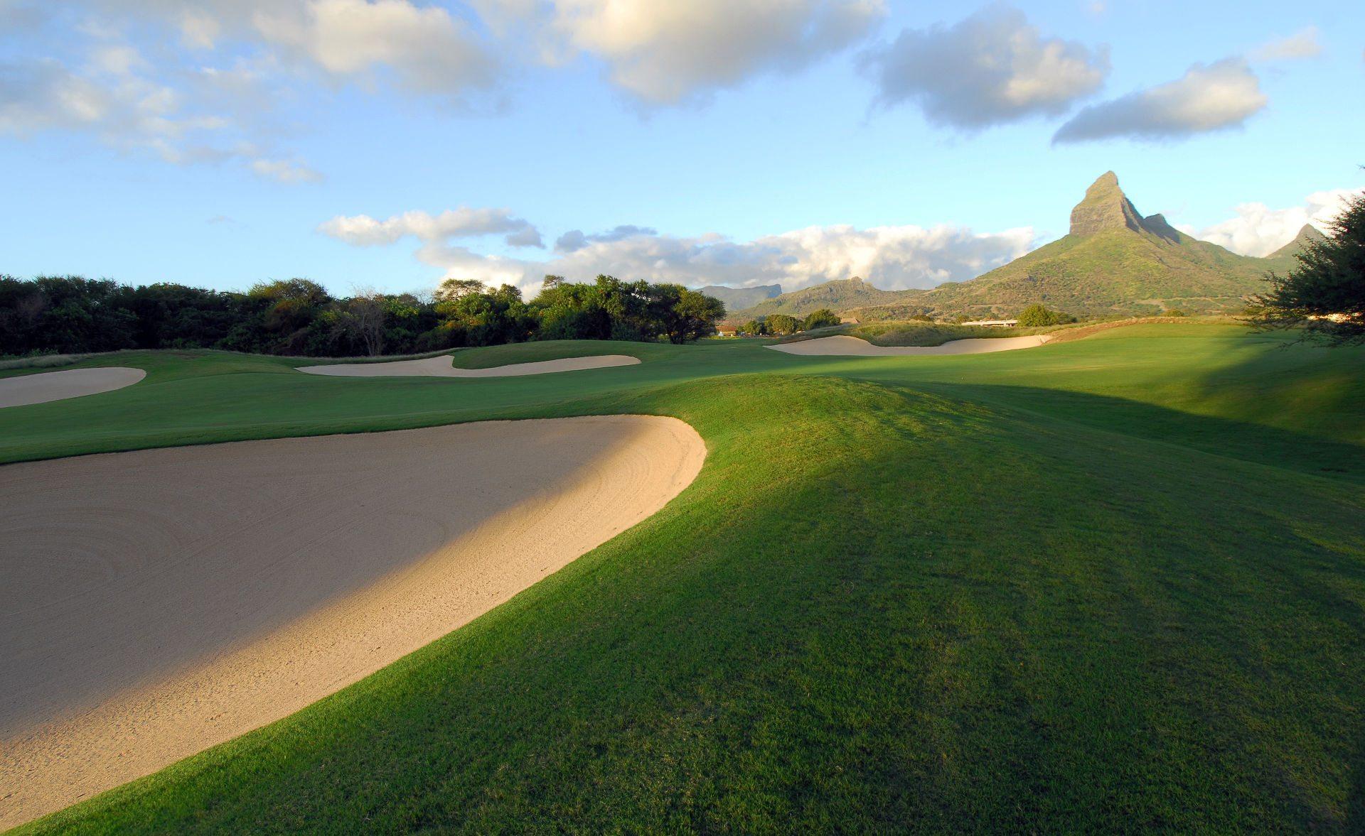 A well maintained fairway nestled with deep sand bunkers