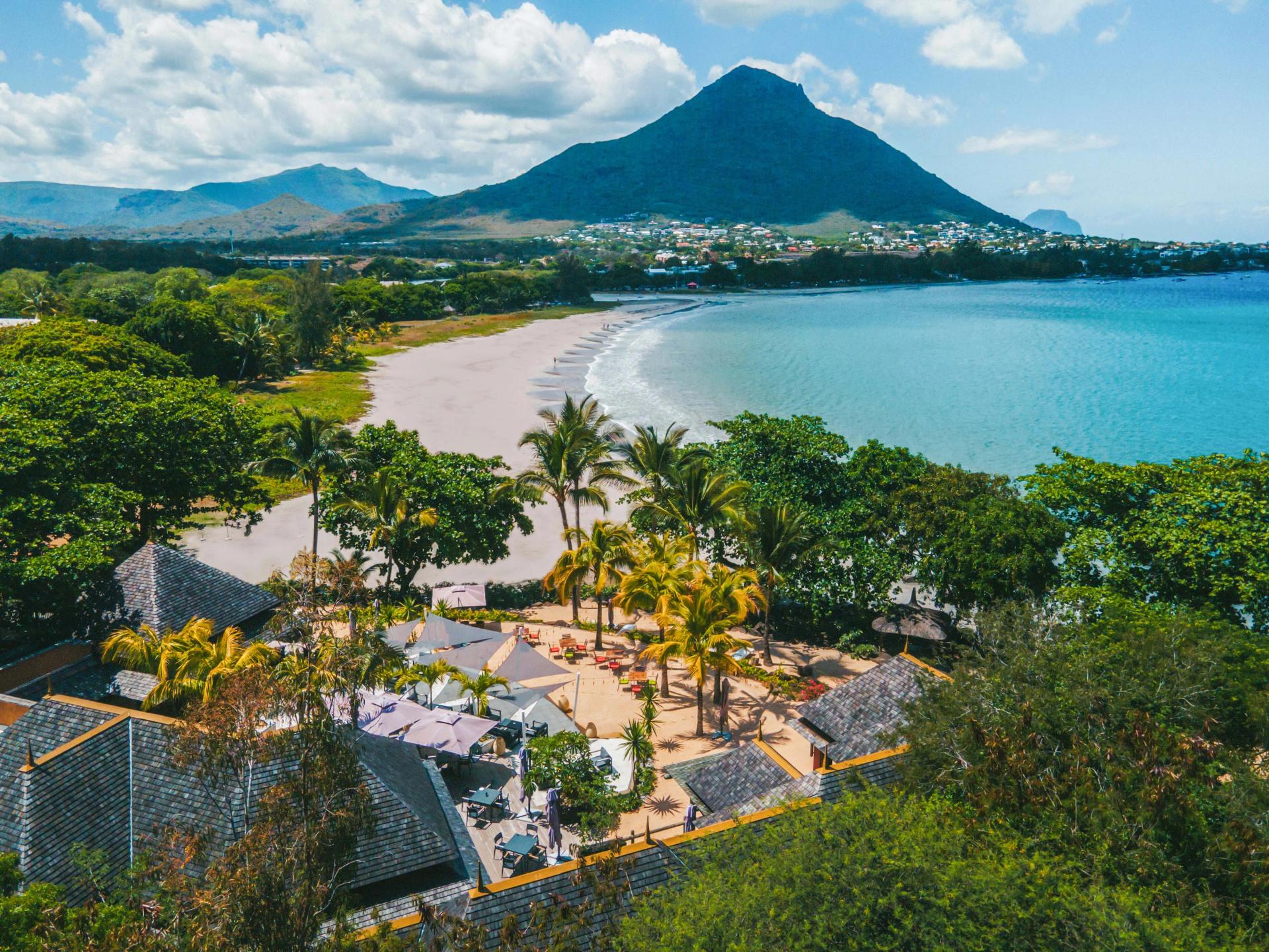 Overhead view of the Tamarina Golf & Spa Boutique Hotel looking out to the coast with mountain views