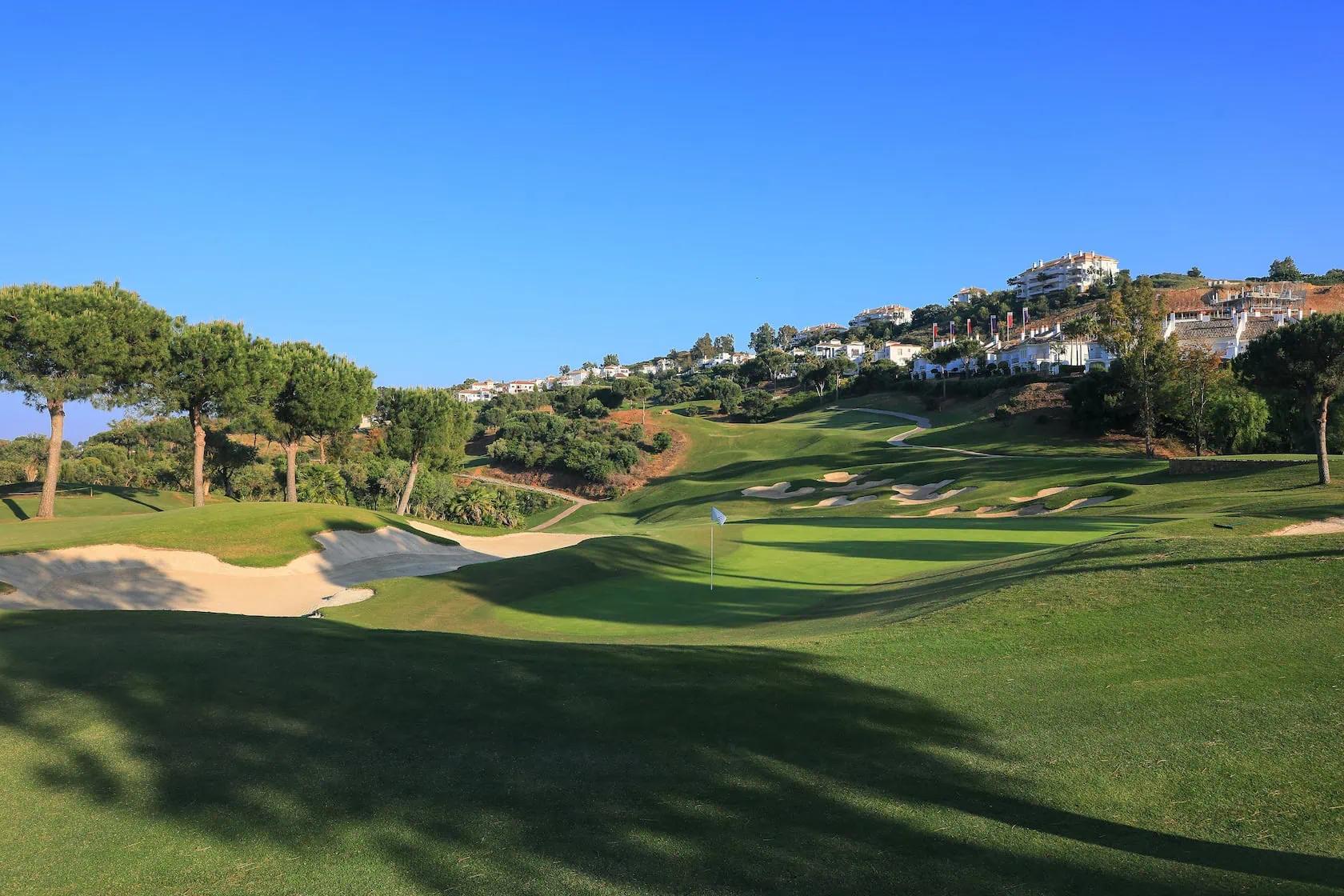 A well maintained fairway under clear blue skies