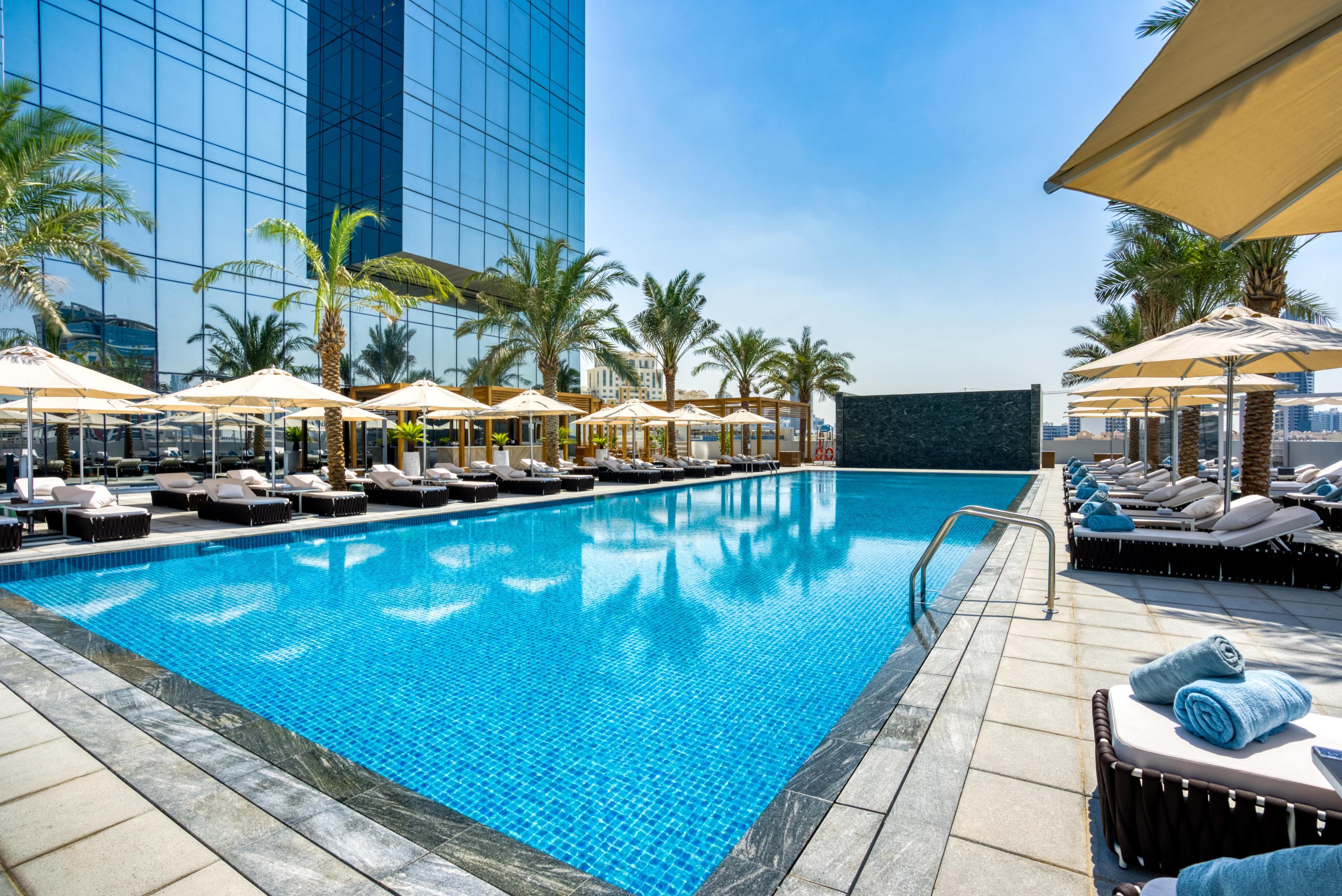 Outdoor rooftop swimming pool at Smart, Modern Dubai Base