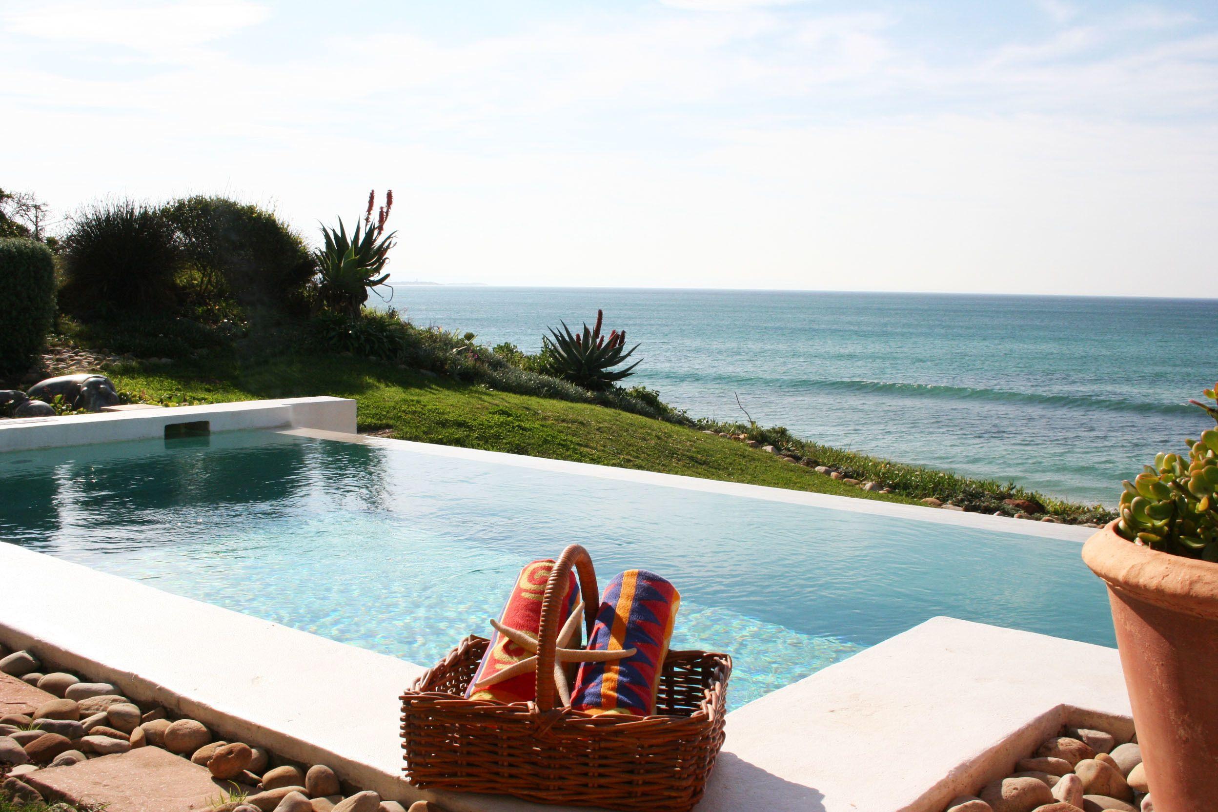 Outdoor swimming pool with coastal views at The Sands at St. Francis Bay