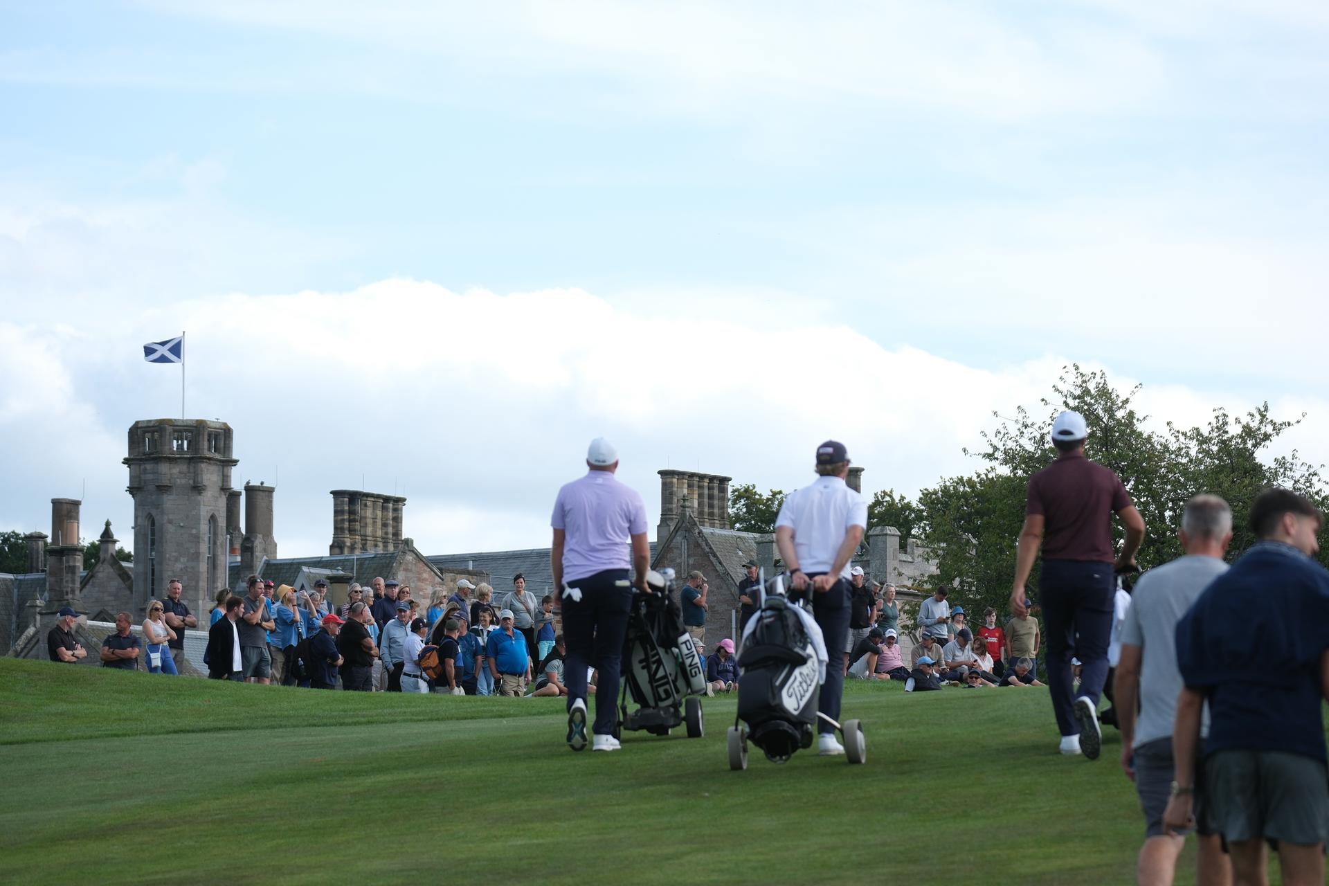 Golfers walking on a well maintained fairway