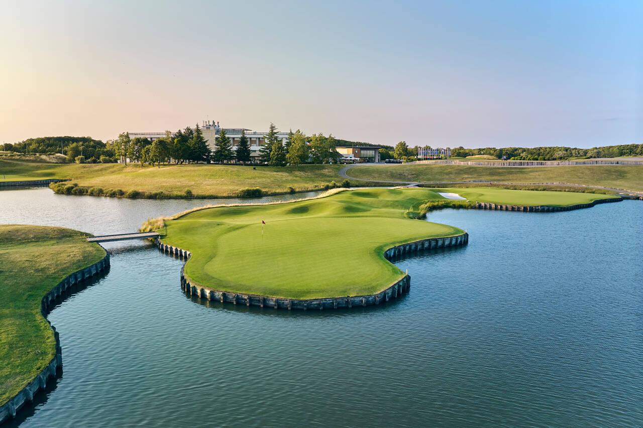 Overhead view of an island green under clear skies