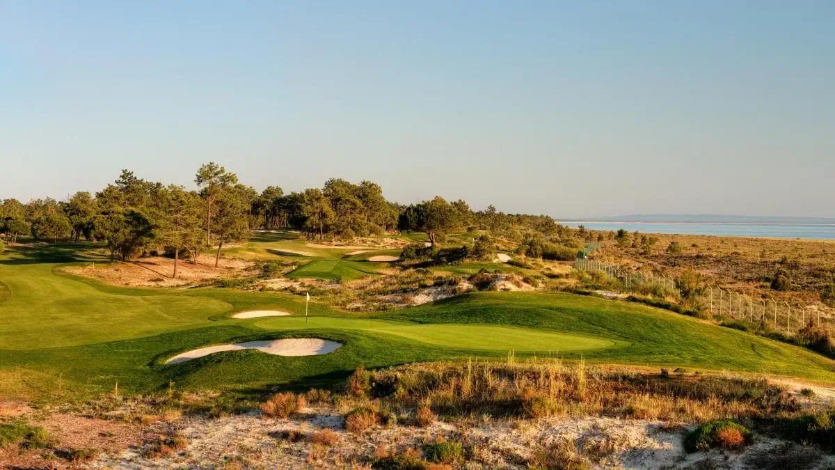 Overhead view of a smooth green surrounded by sand bunkers