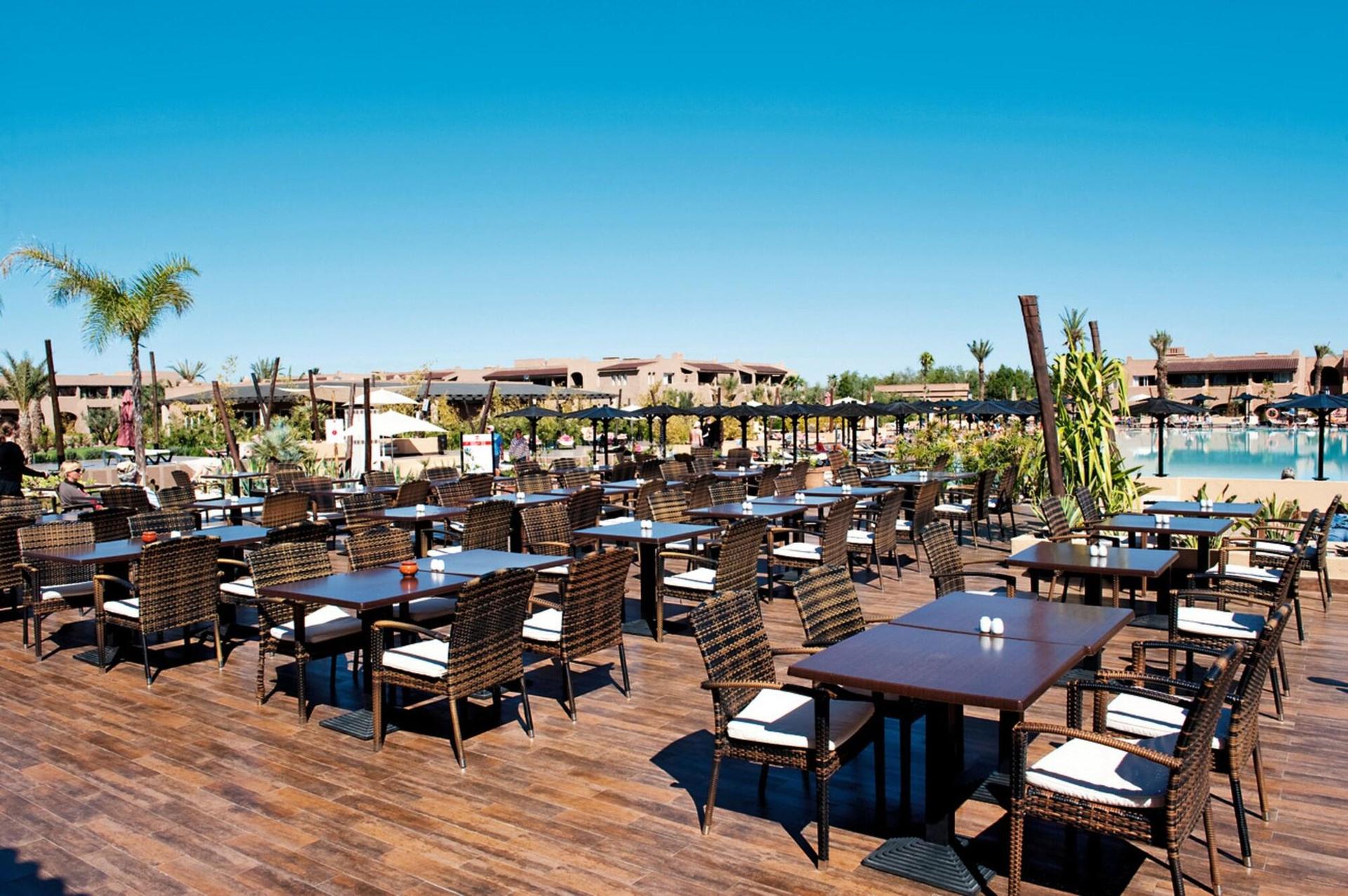 Outdoor poolside dining at Clubhotel Riu Tikida Palmeraie