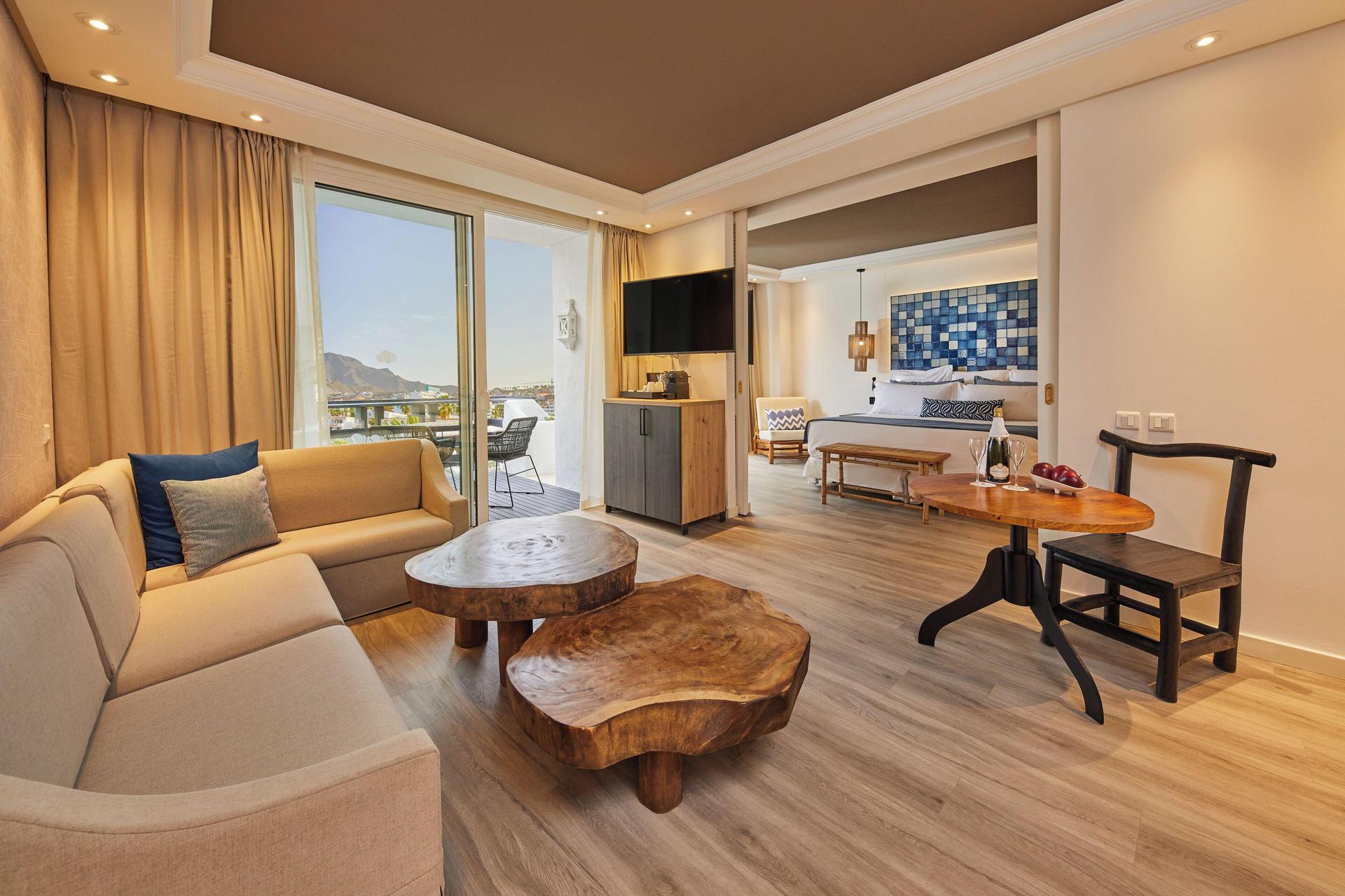 Living room leading to a bedroom as part of a suite at Dreams Jardin Tropical Resort & Spa