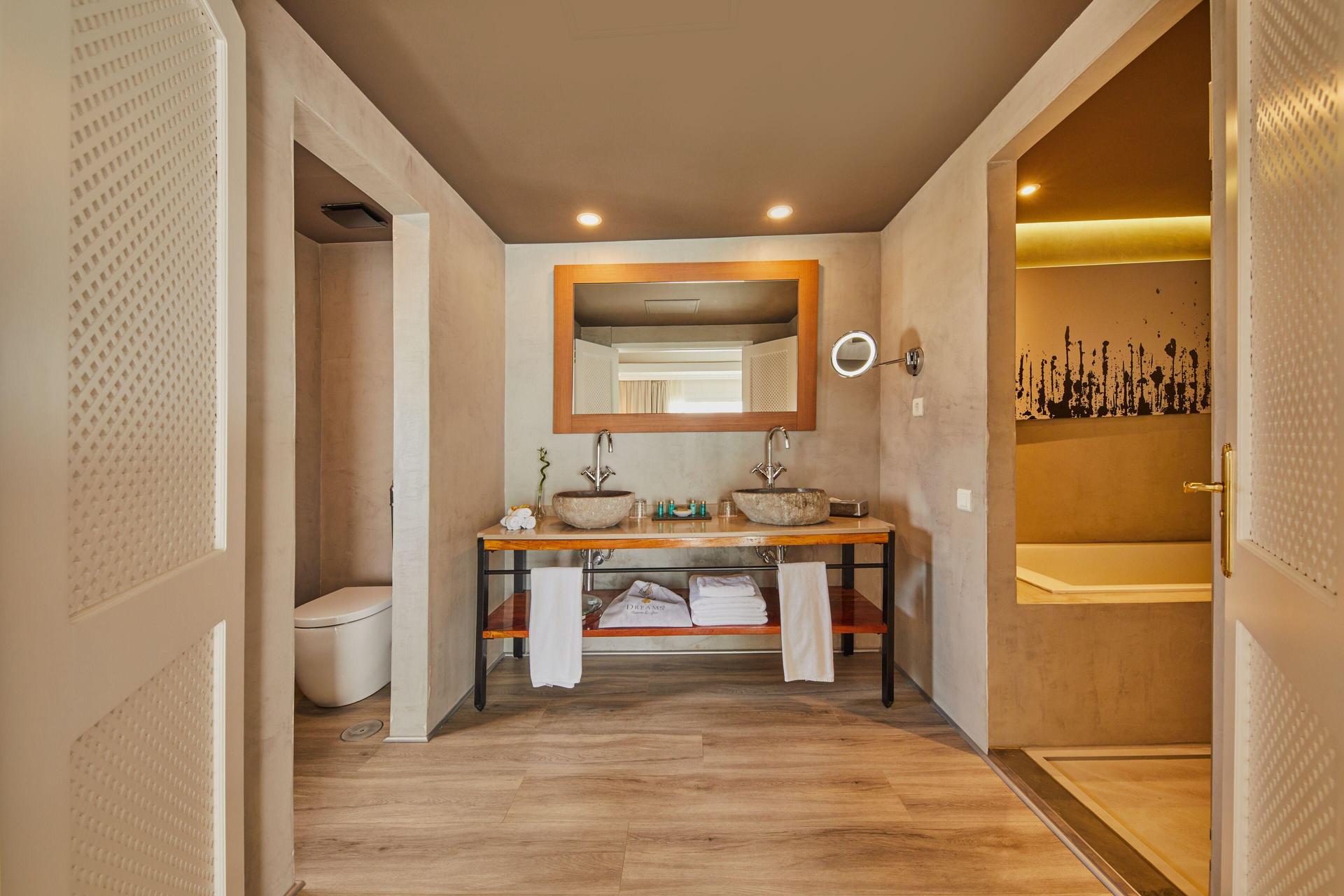 Luxurious bathroom as part of a suite at Dreams Jardin Tropical Resort & Spa