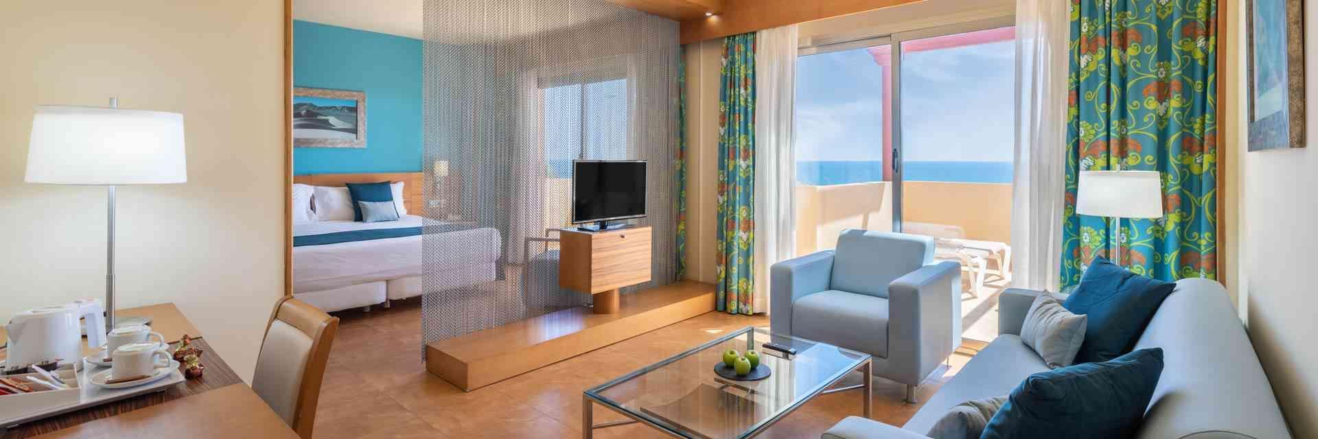 Living room as part of a double bed suite at Elba Carlota Beach & Convention Resort