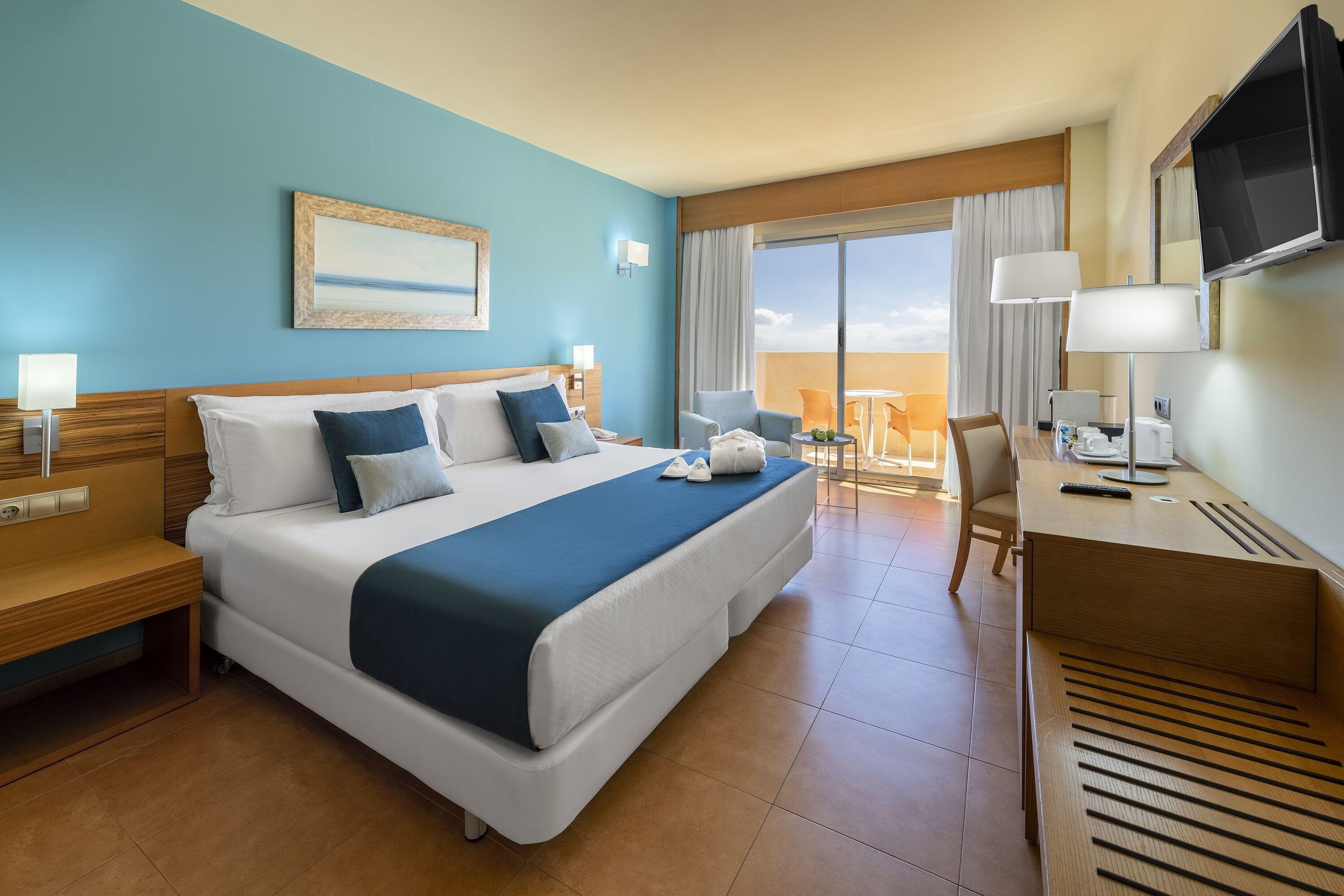 Double bed suite with balcony views at Elba Carlota Beach & Convention Resort