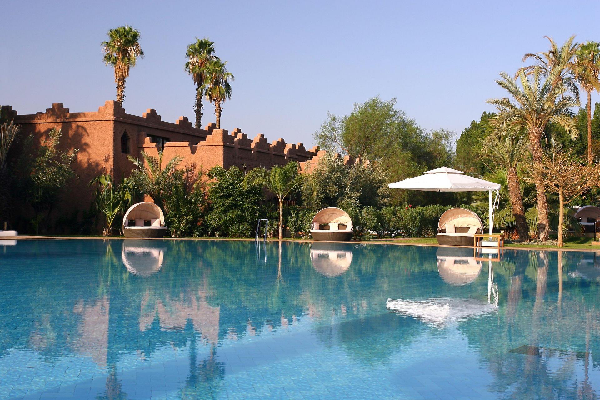 Outdoor pool at Es Saadi Marrakech Resort – Palace