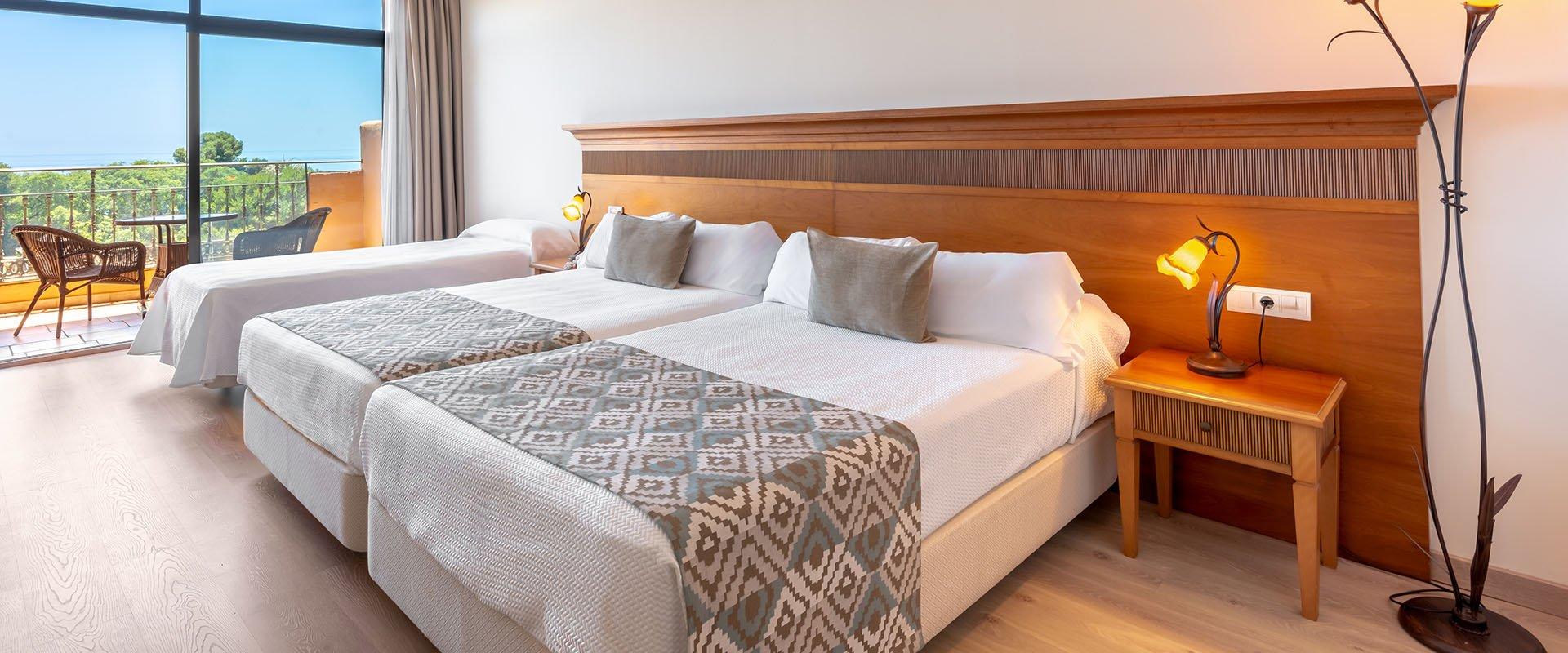 Twin bed suite with window views at Globales Paraiso Beach