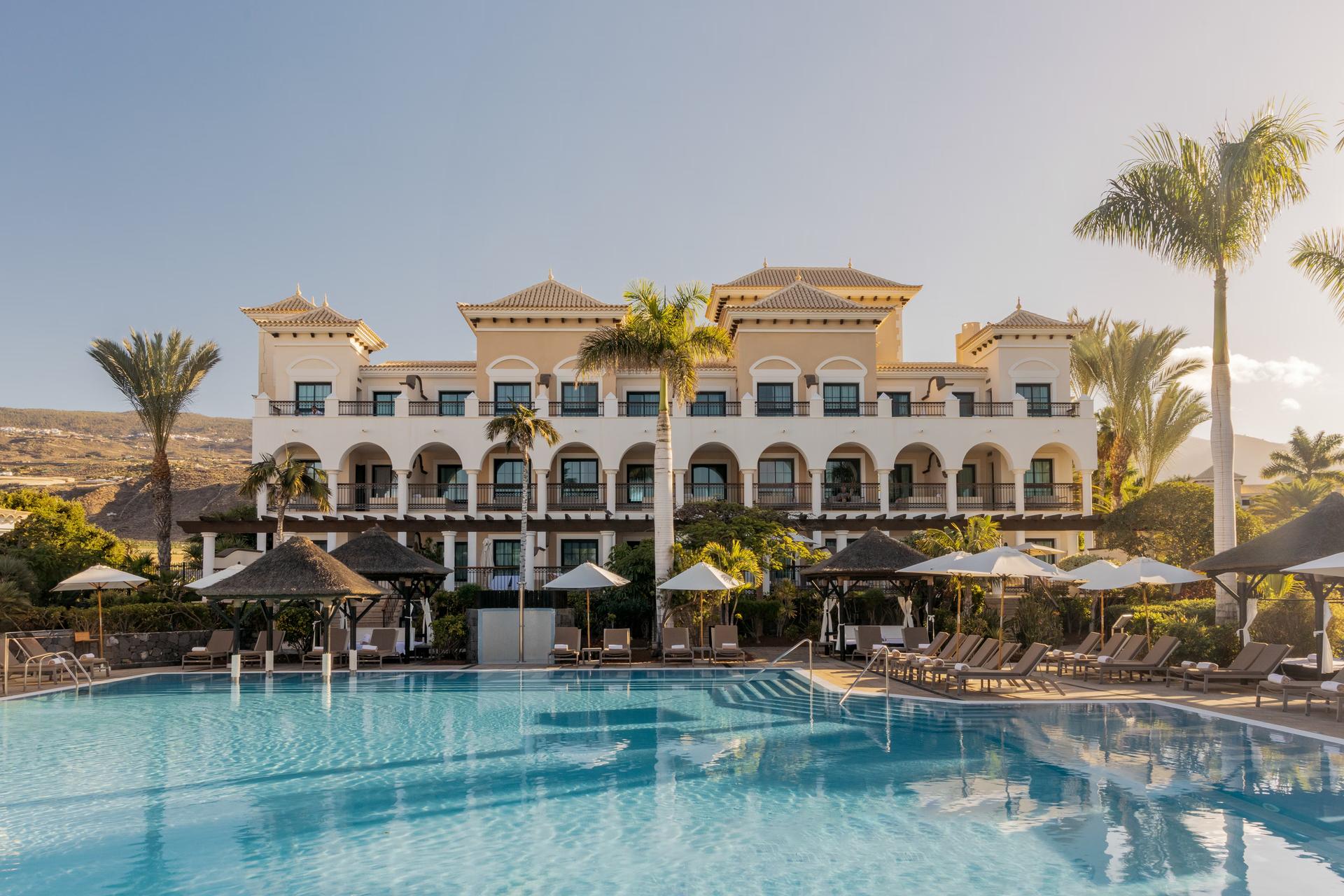 Panoramic view of the Gran Meliá Palacio de Isora building overlooking the outdoor pool