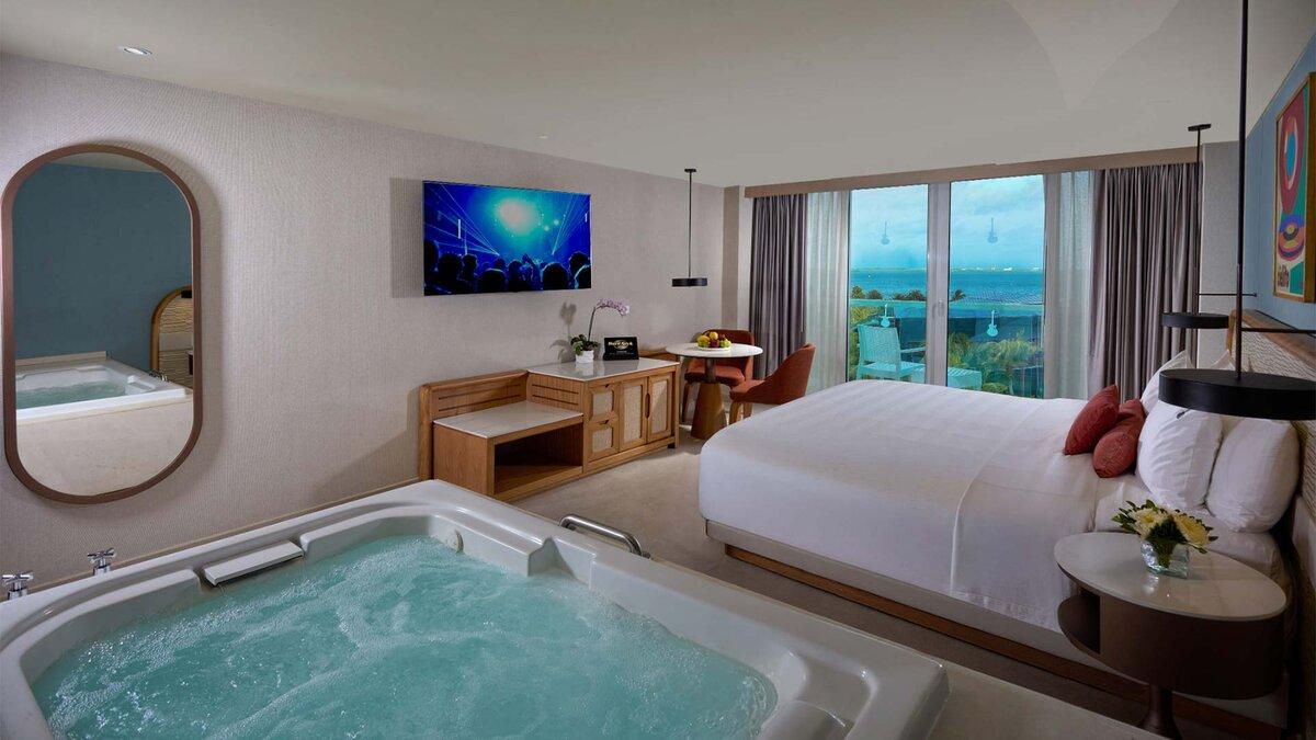 Double bed suite with a jacuzzi and balcony views at Hard Rock Hotel Cancun