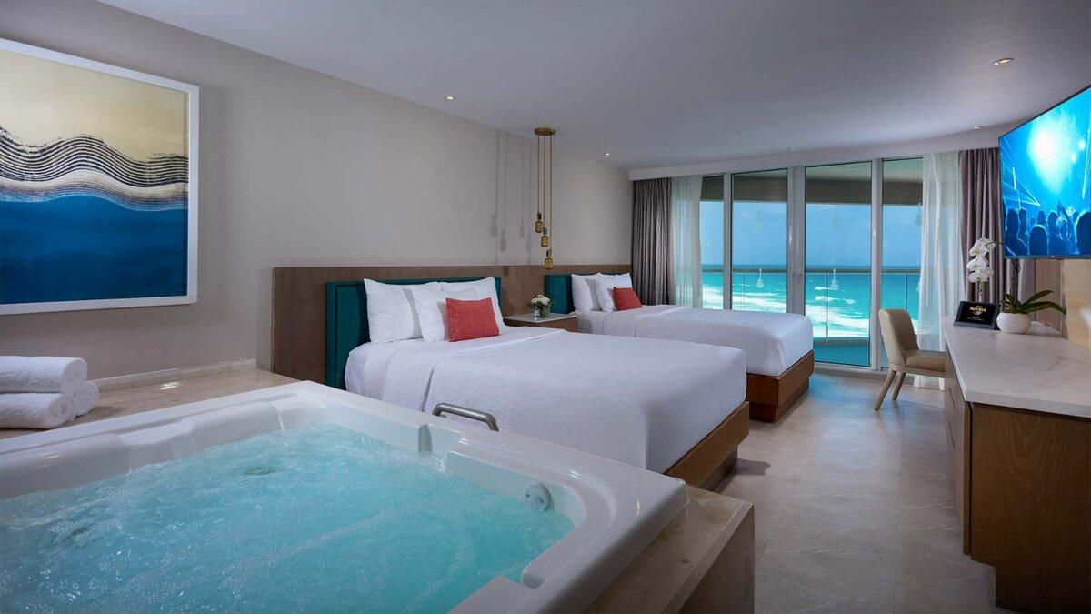 Twin bed suite with a in room jacuzzi and balcony views