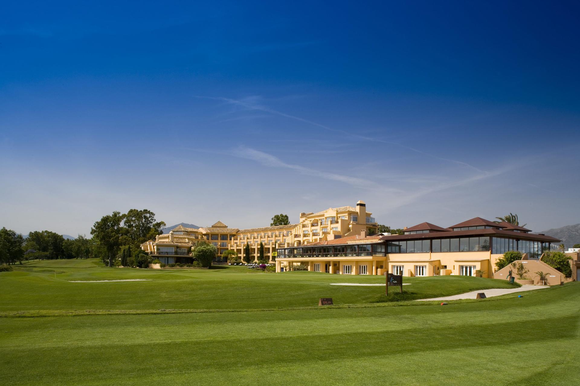 A well maintained fairway with Hotel Guadalmina Spa and Golf Resort in the distnace