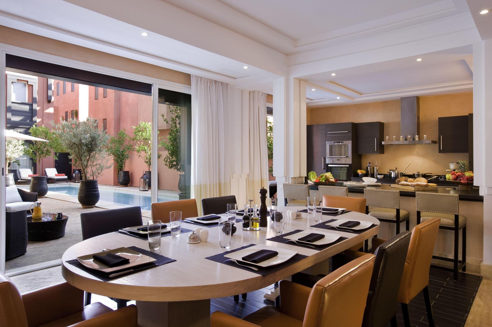 Living room and dining area as part of a villa at Hotel & Ryads Barrière Le Naoura