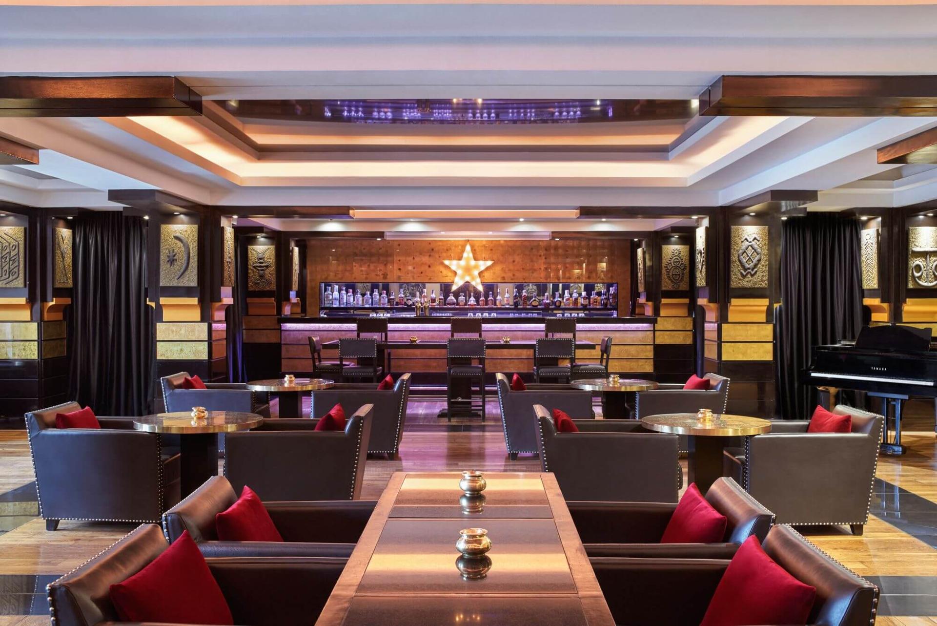 Indoor dining room and bar at Hotel & Ryads Barrière Le Naoura