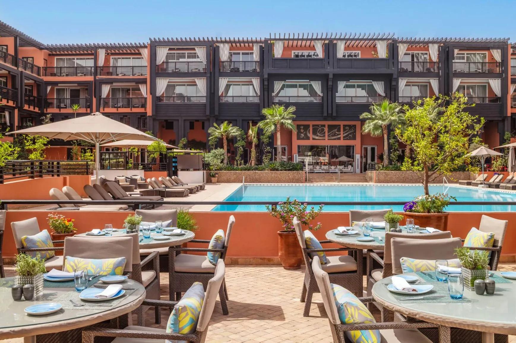 Poolside dining at Hotel & Ryads Barrière Le Naoura