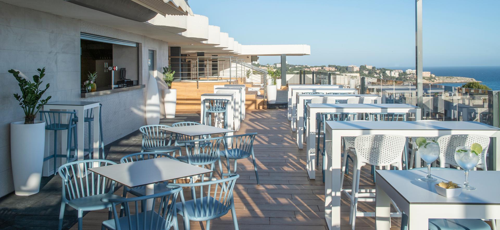 Outdoor rooftop dining with ocean views at Hotel Salou Beach by Pierre & Vacances