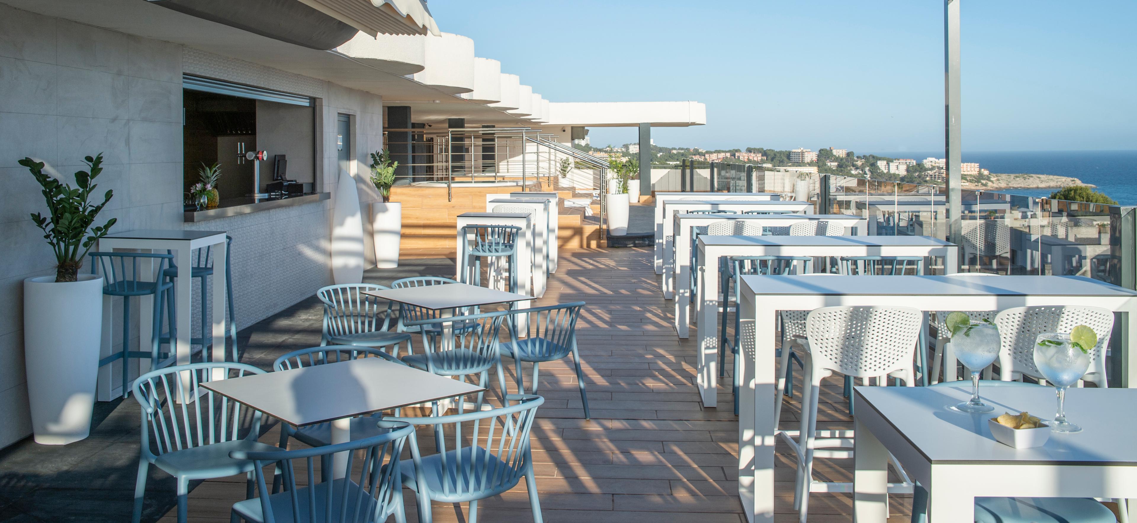 Outdoor rooftop dining with ocean views at Hotel Salou Beach by Pierre & Vacances