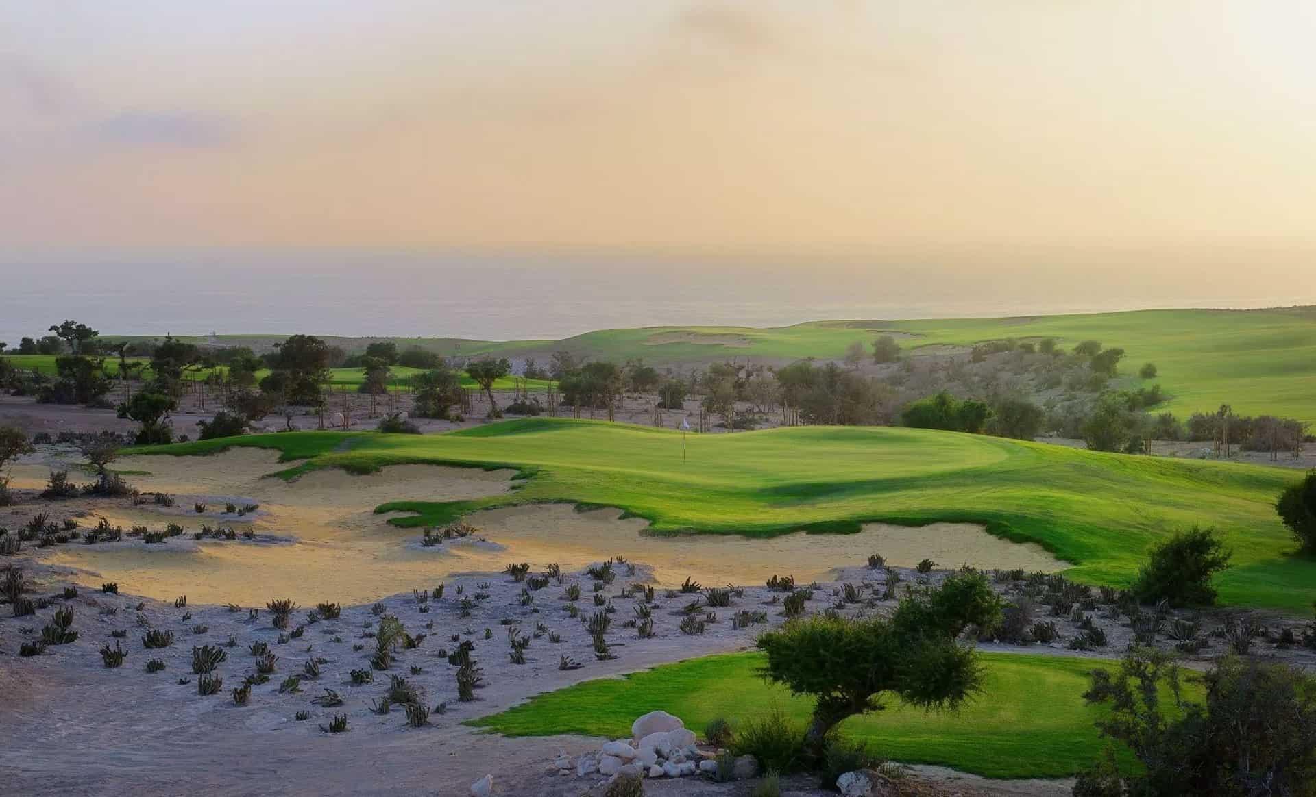 A well maintained fairway nestled with sand bunkers at Hyatt Place Taghazout Bay