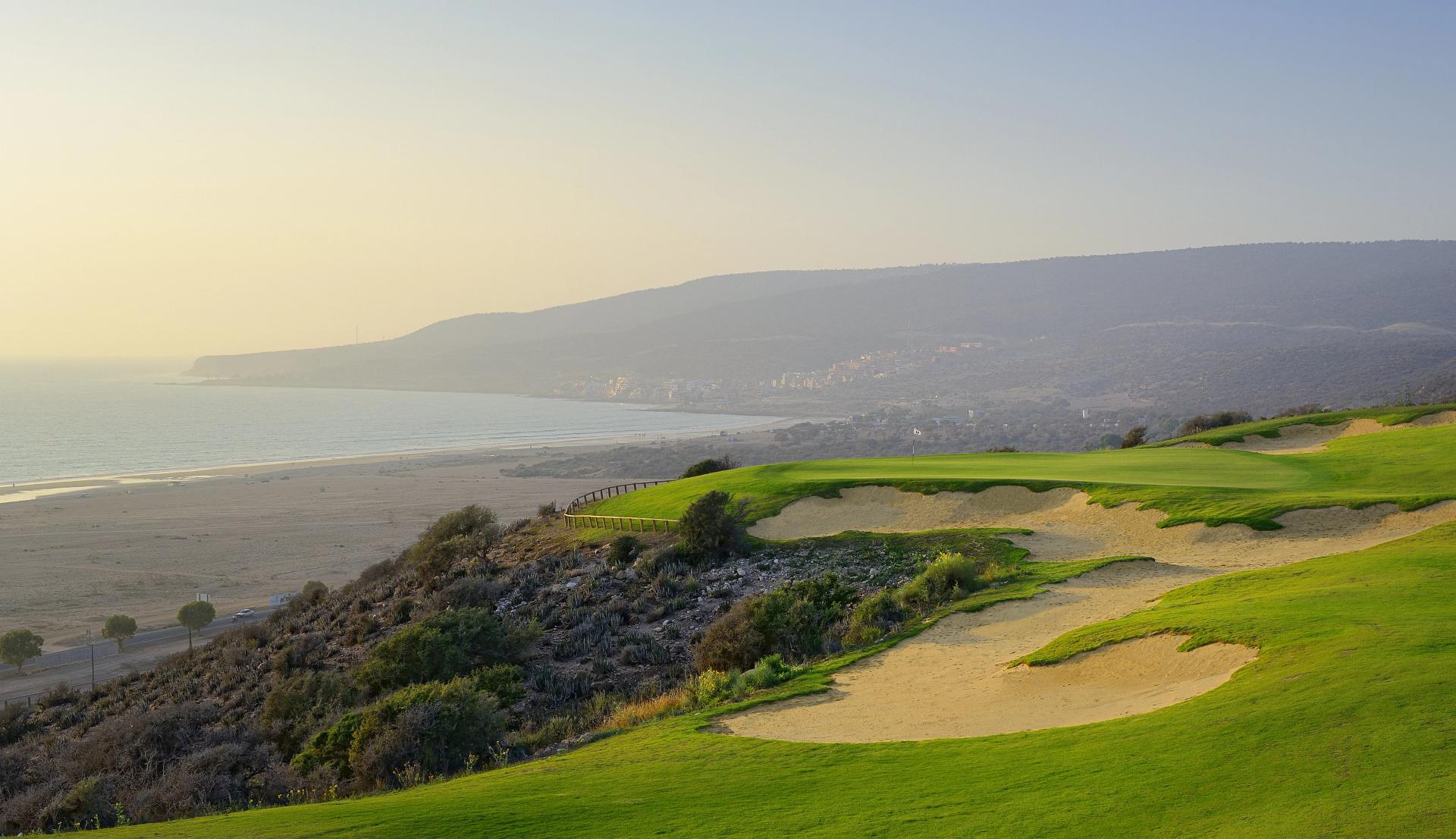 A well maintained coastal fairway nestled with sand bunkers at Hyatt Place Taghazout Bay