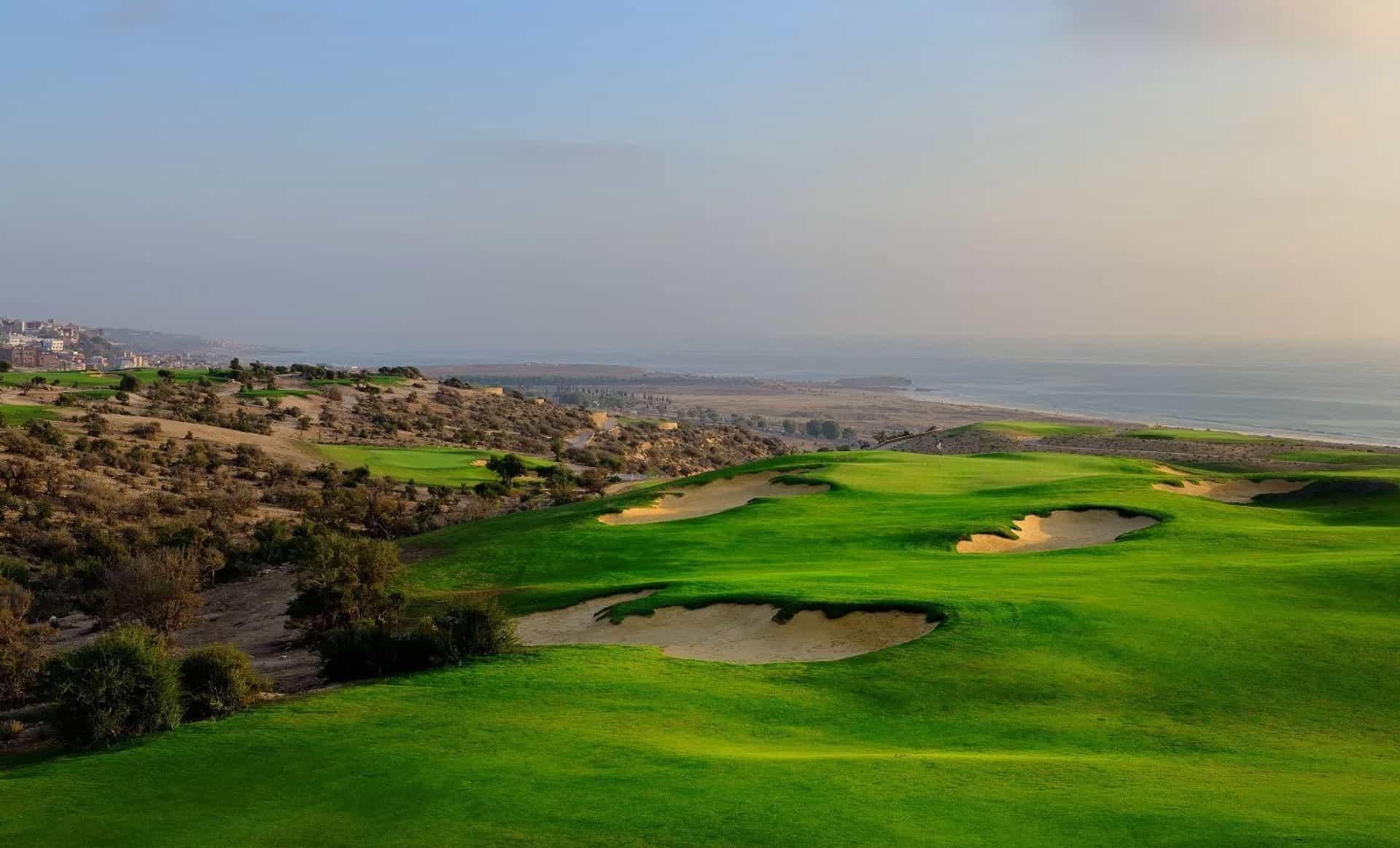 A well maintained fairway nestled with sand bunkers at Hyatt Place Taghazout Bay