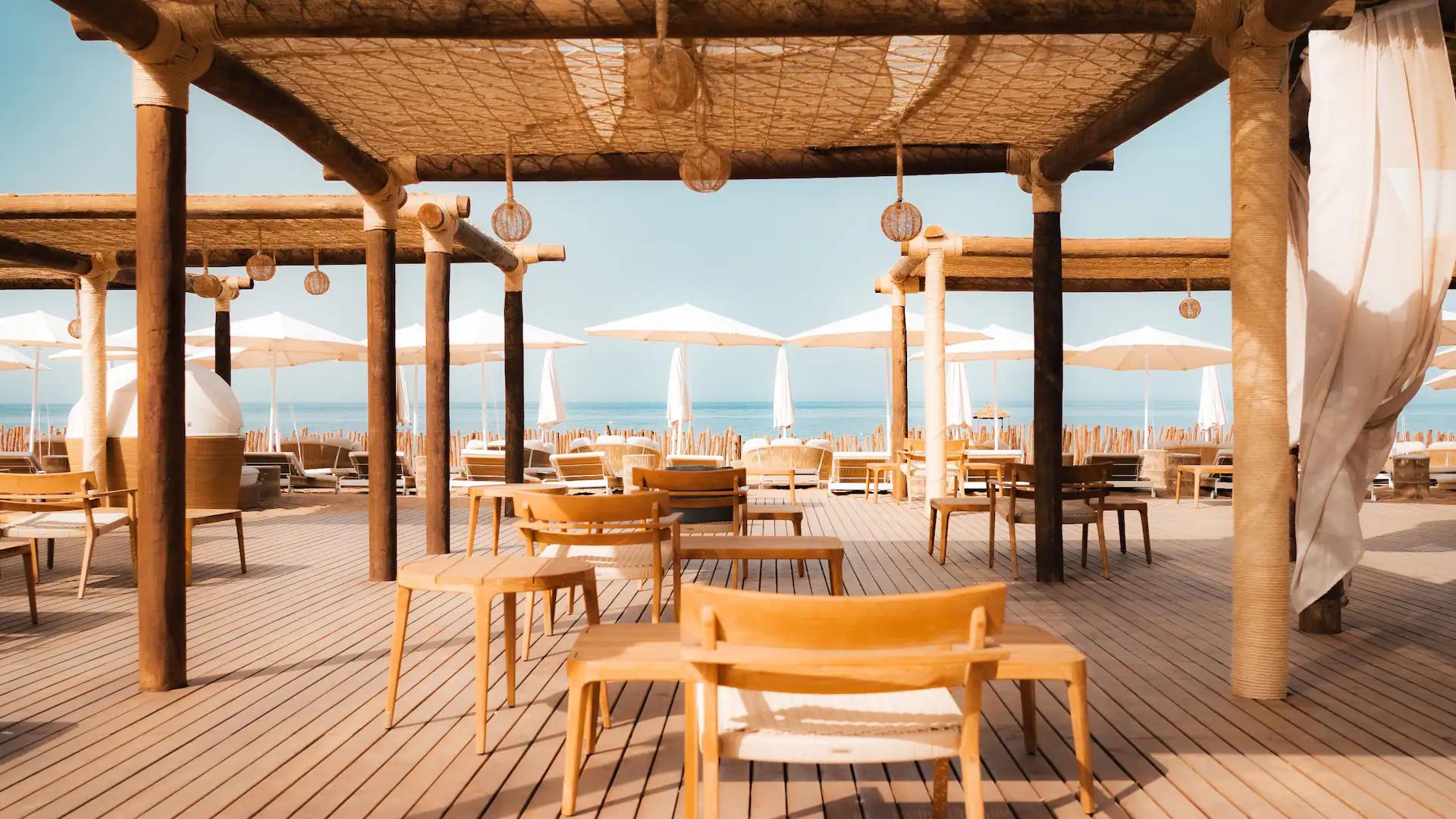 Outdoor poolside dining area at Hyatt Regency Taghazout Bay