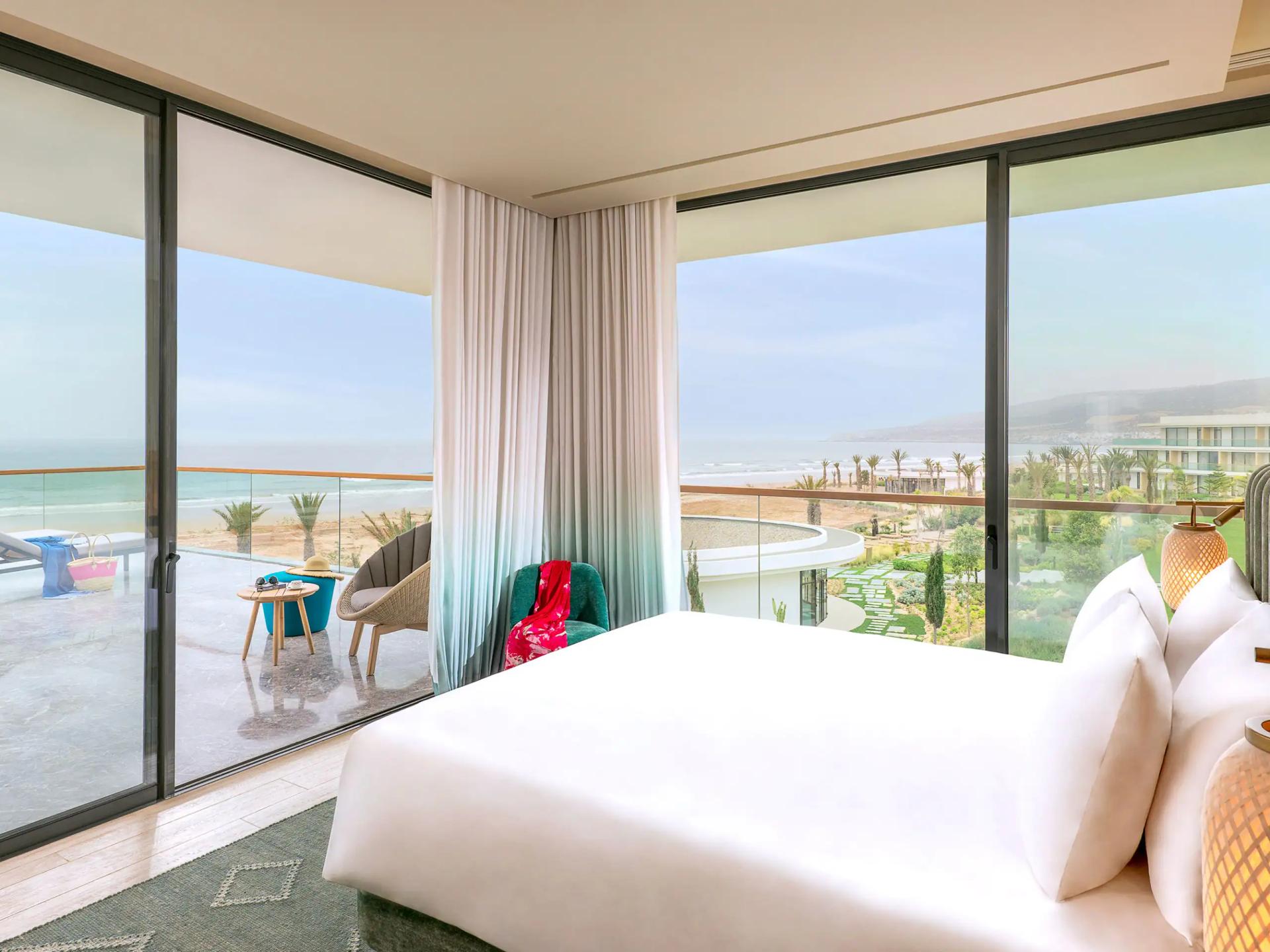 Double bed suite with a balcony & panoramic beach views