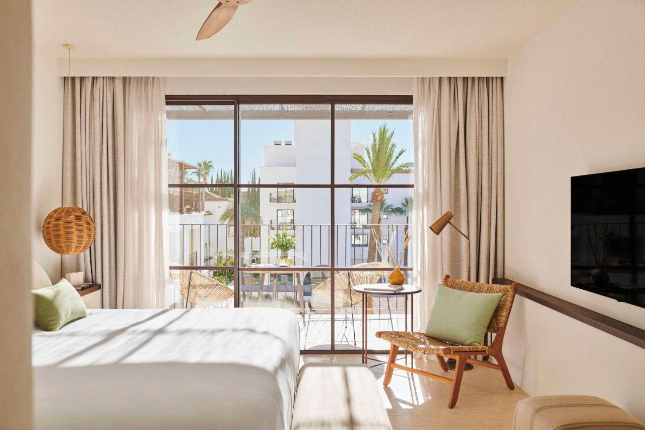 Modern double bed suite with a balcony at La Zambra Resort