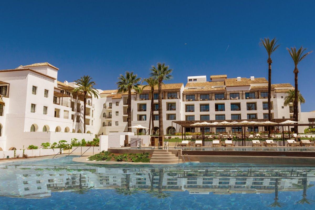 Panoramic view of the La Zambra Resort building overlooking the outdoor pool