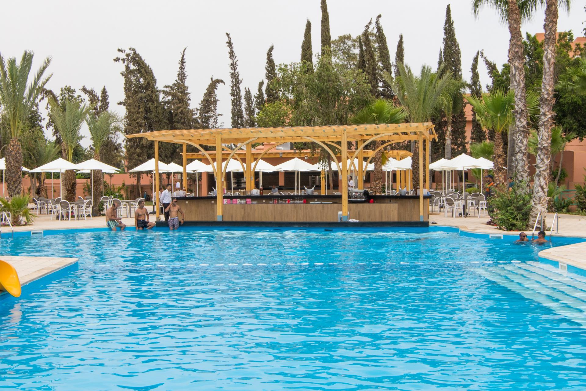 Outdoor swimming with a poolside bar at Labranda Rose and Aqua Parc Hotel