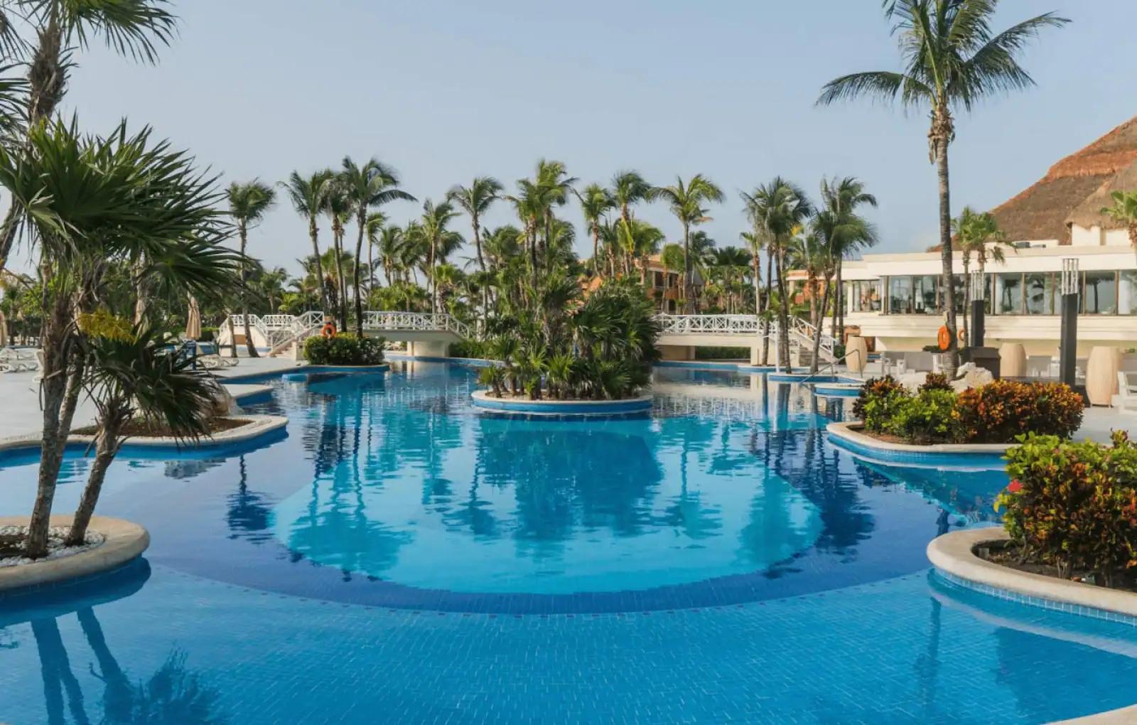 Panoramic view of the outdoor swimming pool at Luxury Bahia Principe Akumal