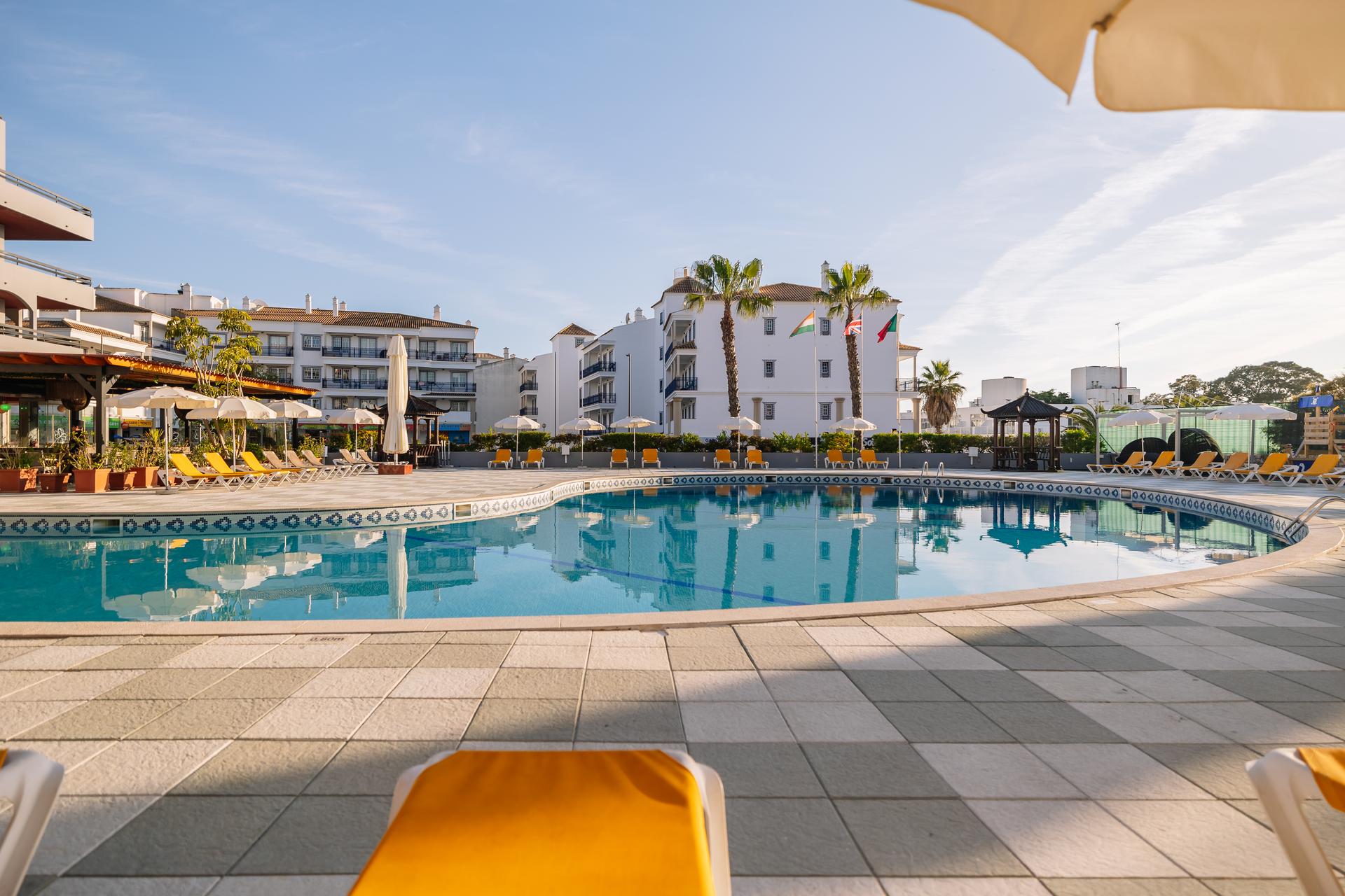 Outdoor swimming pool at Muthu Oura Praia Hotel