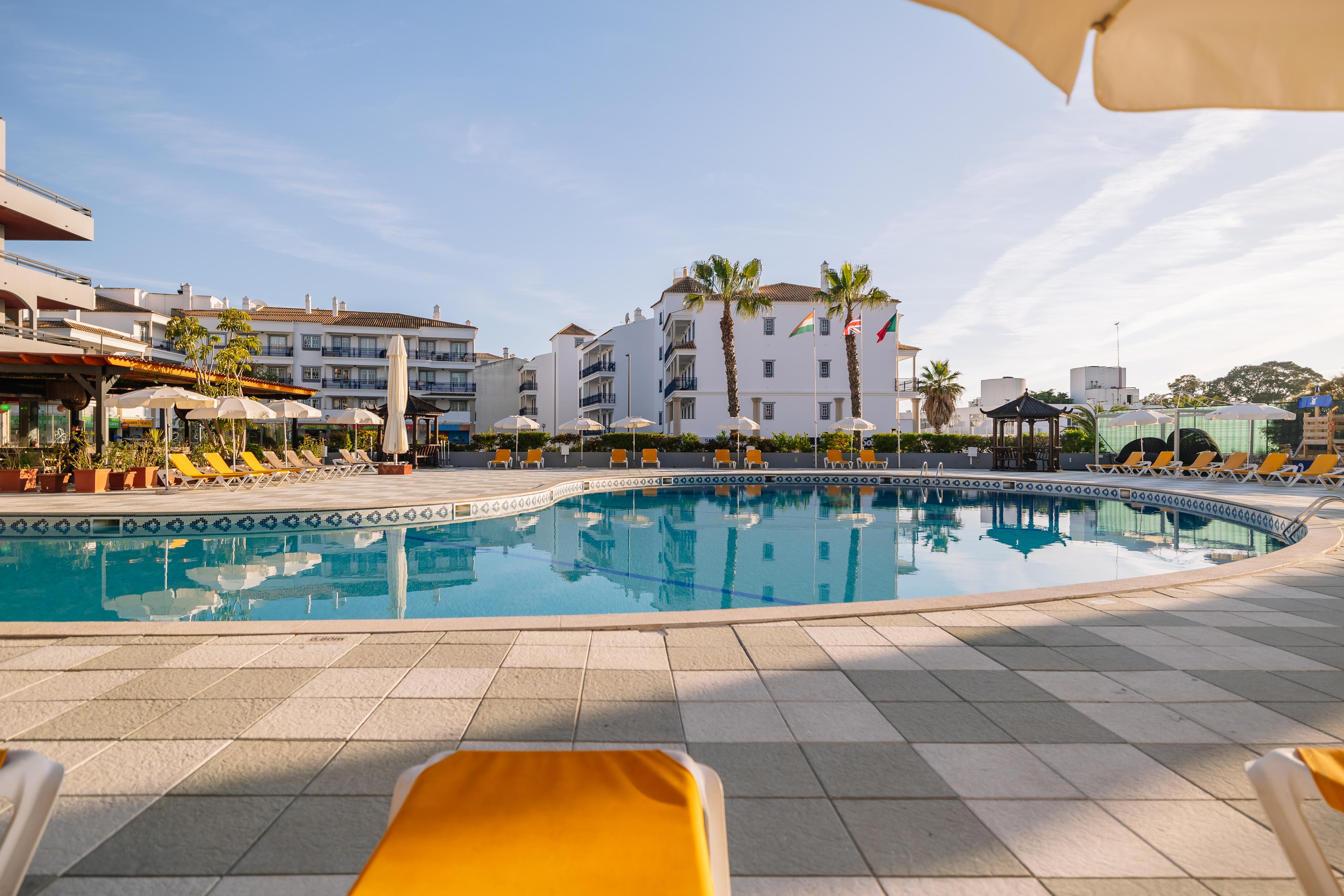 Outdoor swimming pool at Muthu Oura Praia Hotel