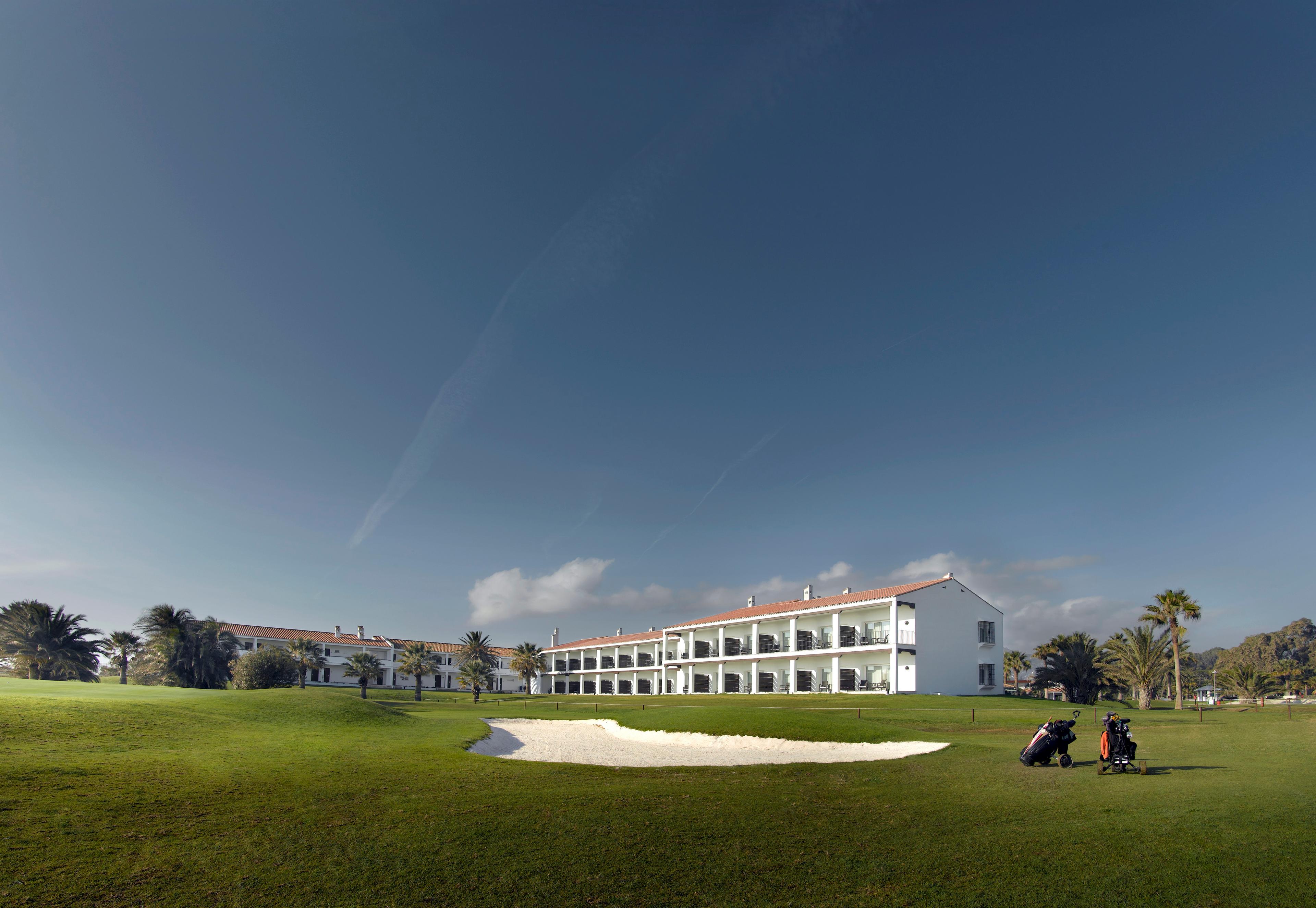 Panoramic view of the Parador de Malaga Golf building overlooking the course