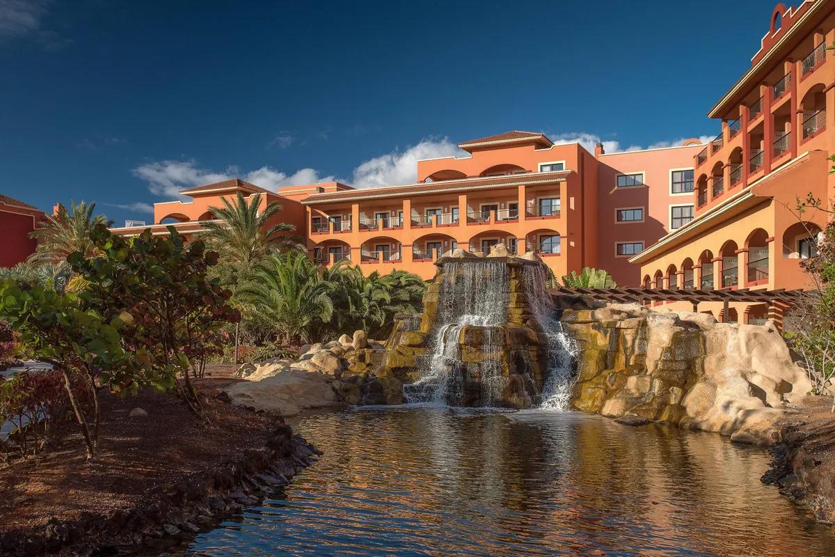 Panoramic view of the Sheraton Fuerteventura Beach, Golf & Spa Resort building with a water fall