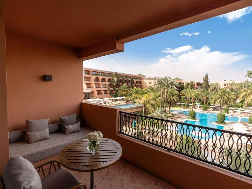 Balcony views of the outdoor swimming pool at Sofitel Marrakech Palais Imperial & Spa