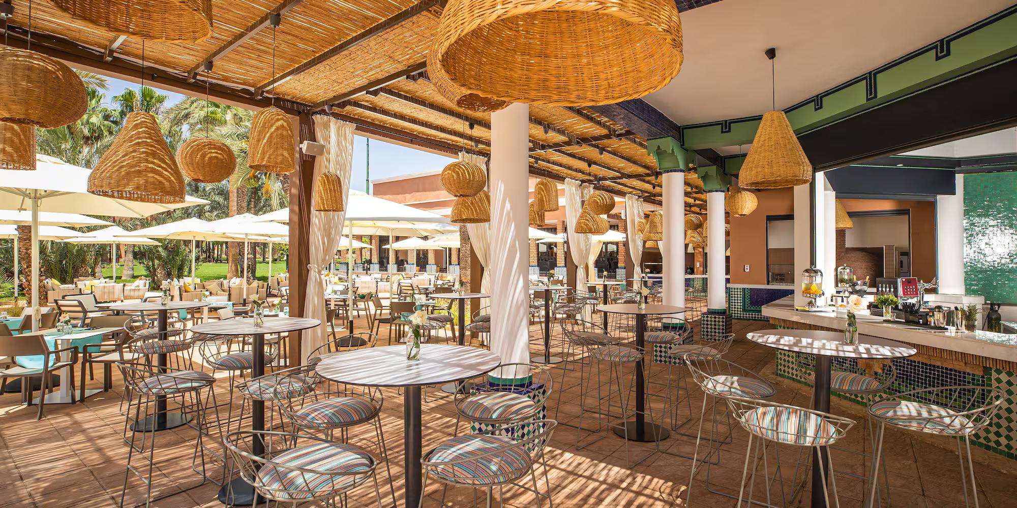 Outdoor dining area at Sol Oasis Marrakech by Melia