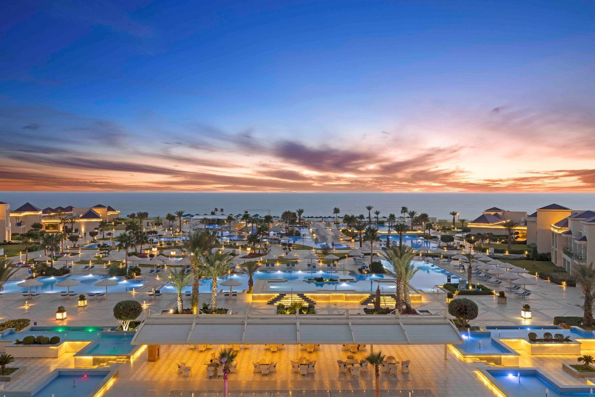 Overhead view of White Beach Resort Taghazout lit up at evening