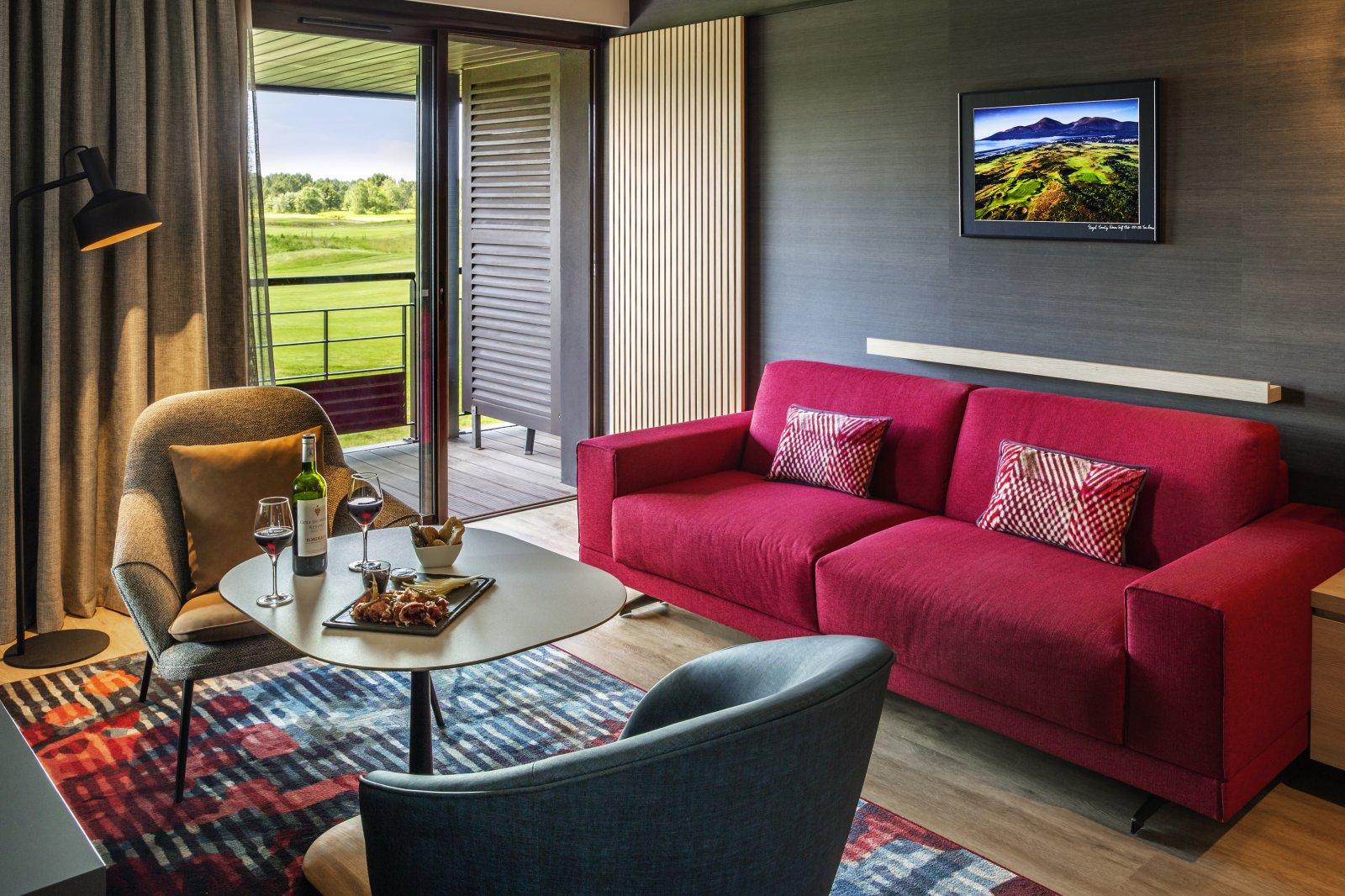 Living room as part of a double bed suite with course views