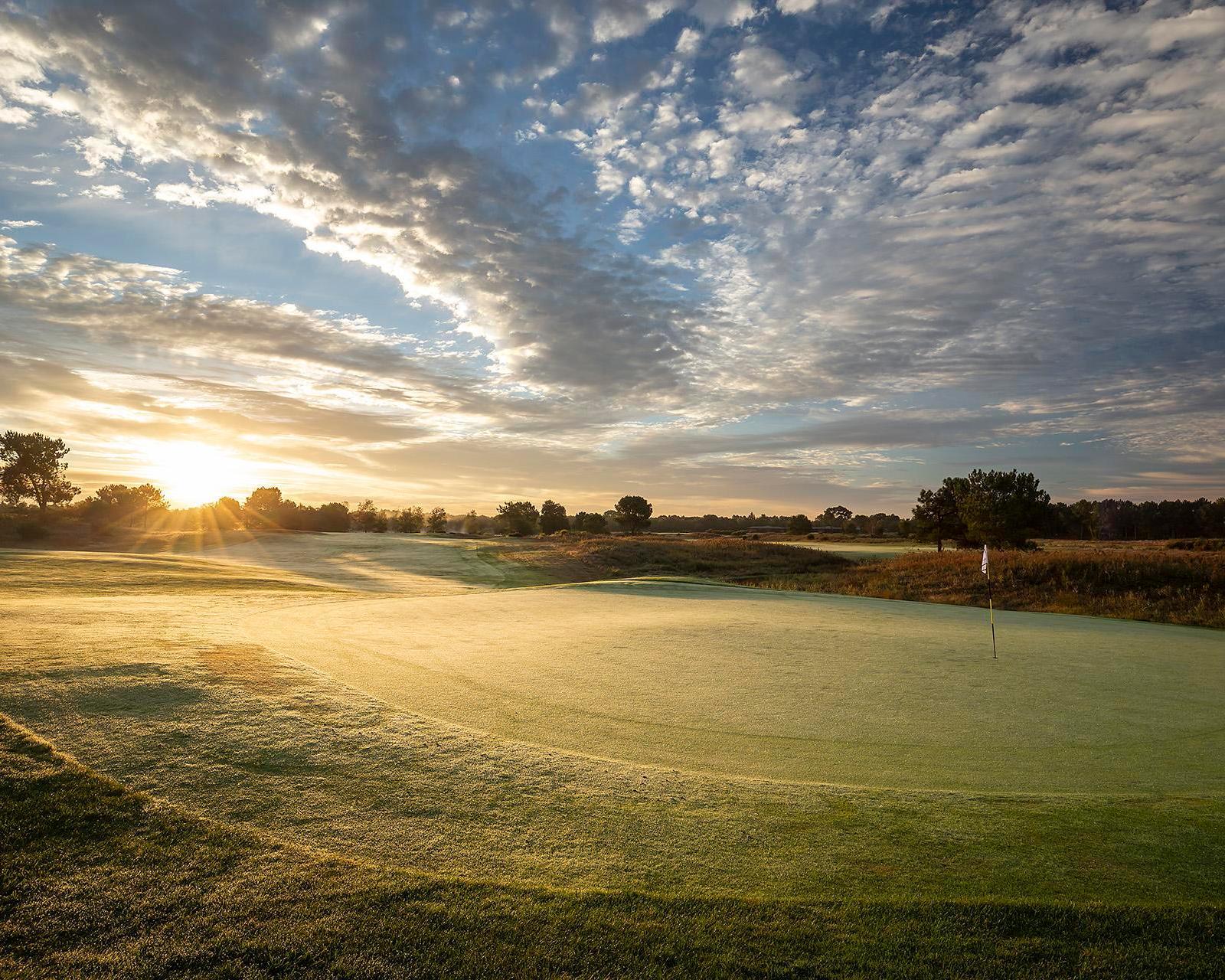 Sun shining over a smooth green