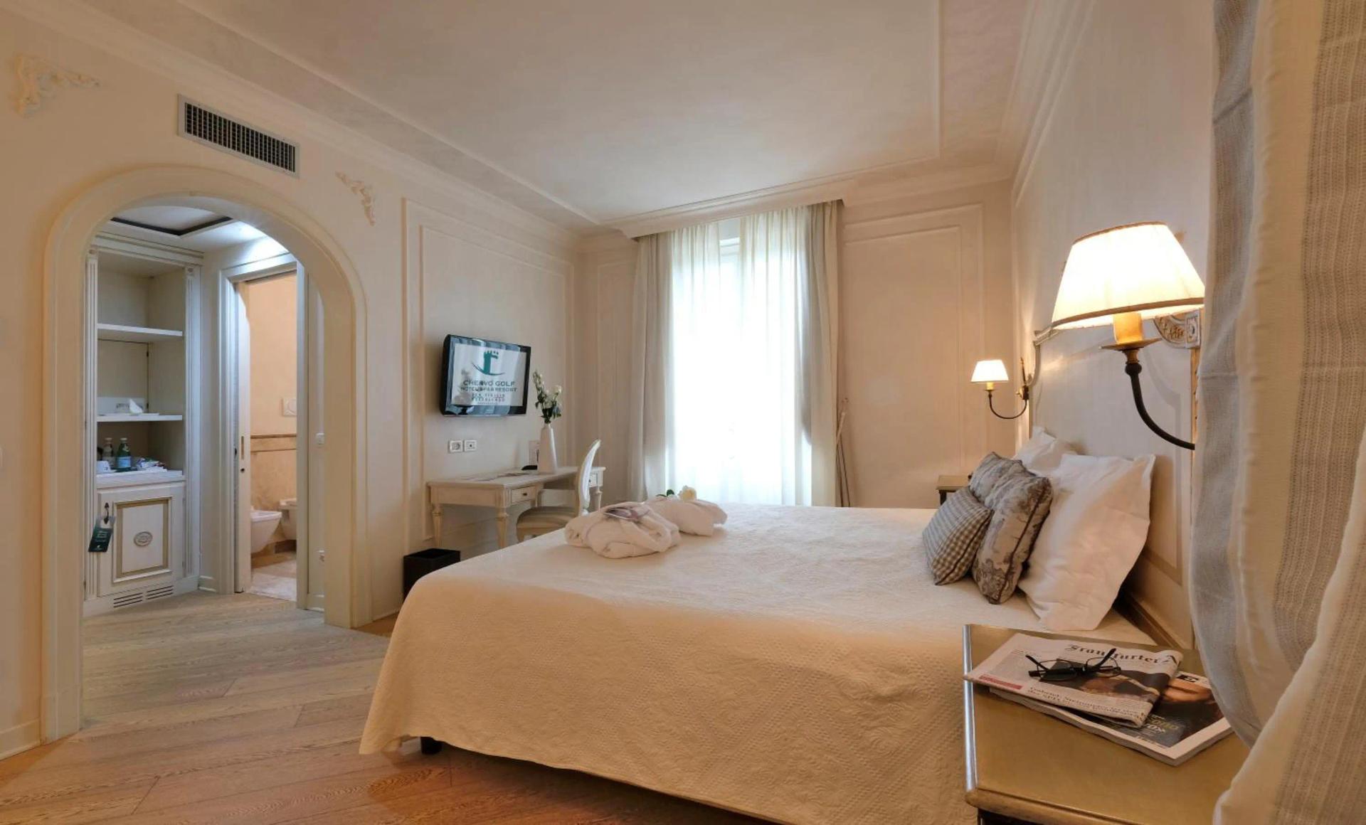 Double bed suite at Chervò Golf Hotel Spa & Resort
