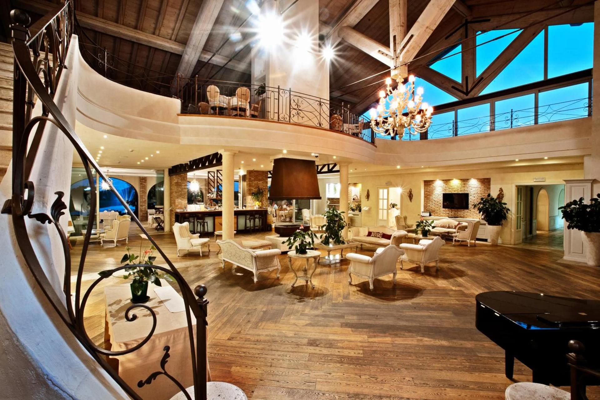Indoor dining and lounging area at Chervò Golf Hotel Spa & Resort